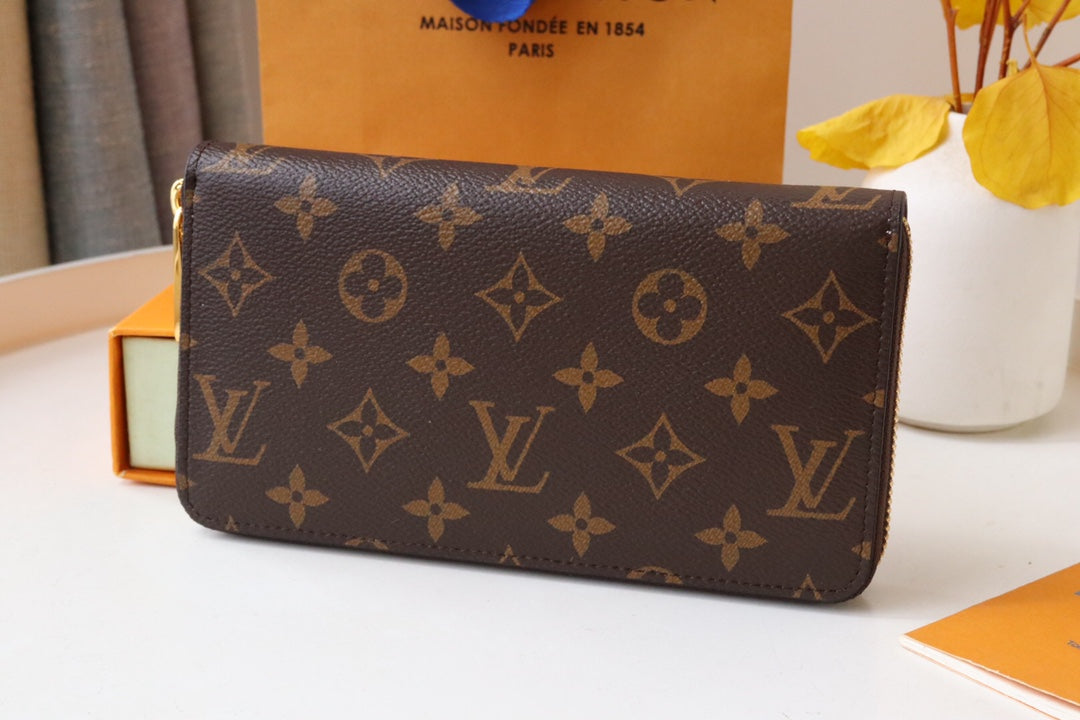 ZIPPY WALLET 9.5 MONOGRAM CANVAS