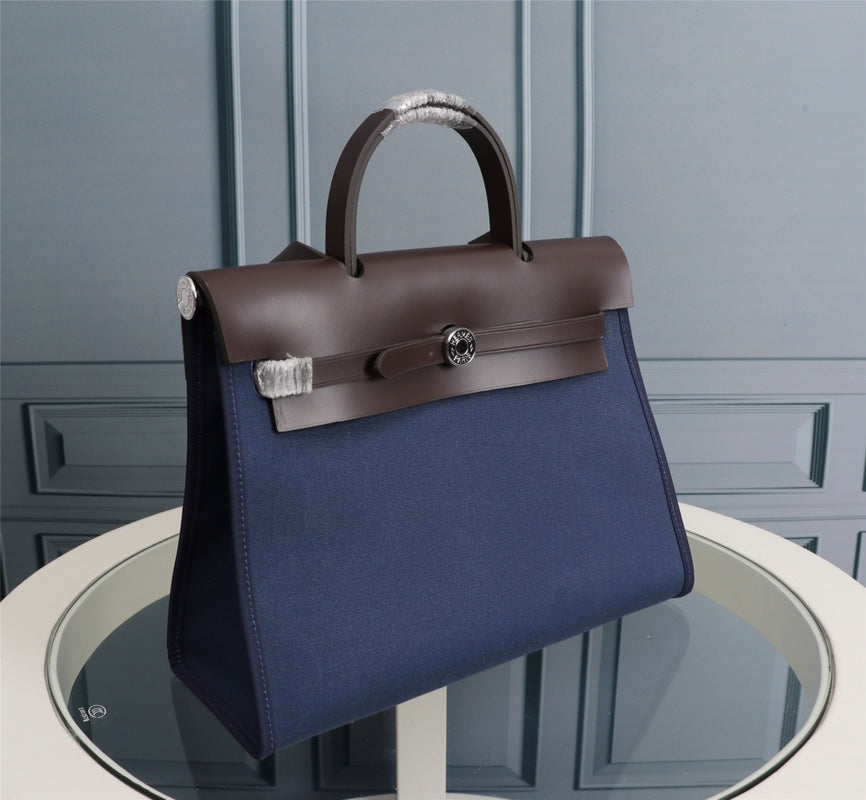 HM HERBAG ZIP 31 NAVY AND CHOCOLATE CANVAS