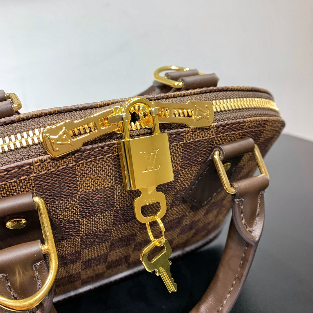 BRAIDED ALMA BB 23 IN BROWN DAMIER EBENE CANVAS GOLD BUCKLE