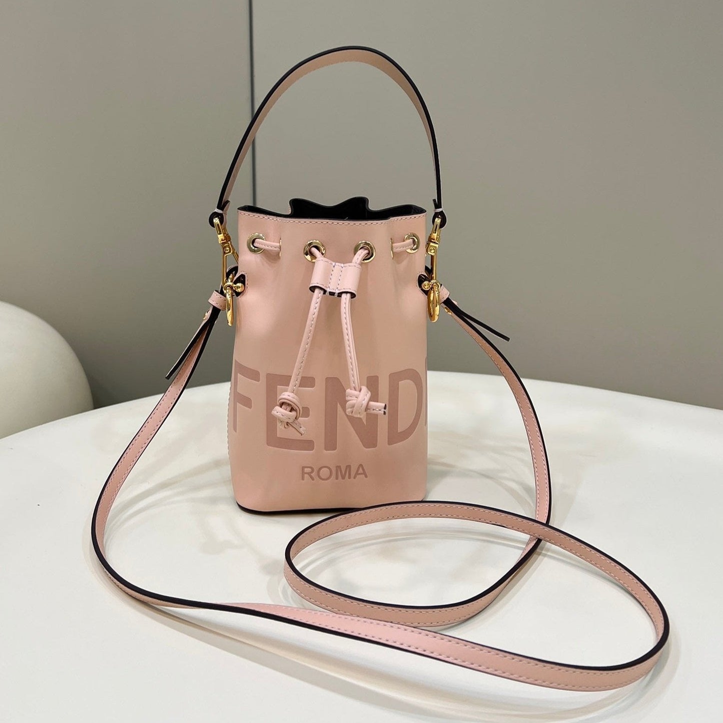 MON TRESOR MINI 18 BAG IN PEACHY PINK CALFSKIN FF WITH GOLD HARDWARE