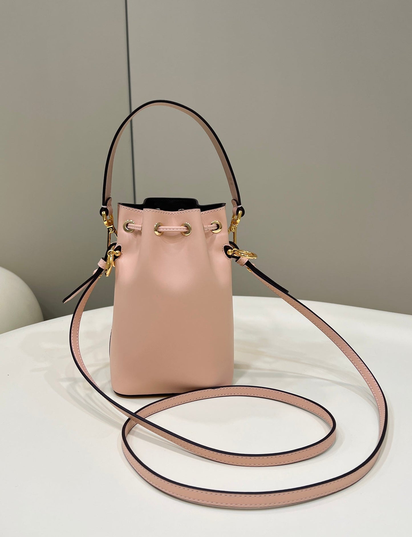 MON TRESOR MINI 18 BAG IN PEACHY PINK CALFSKIN FF WITH GOLD HARDWARE