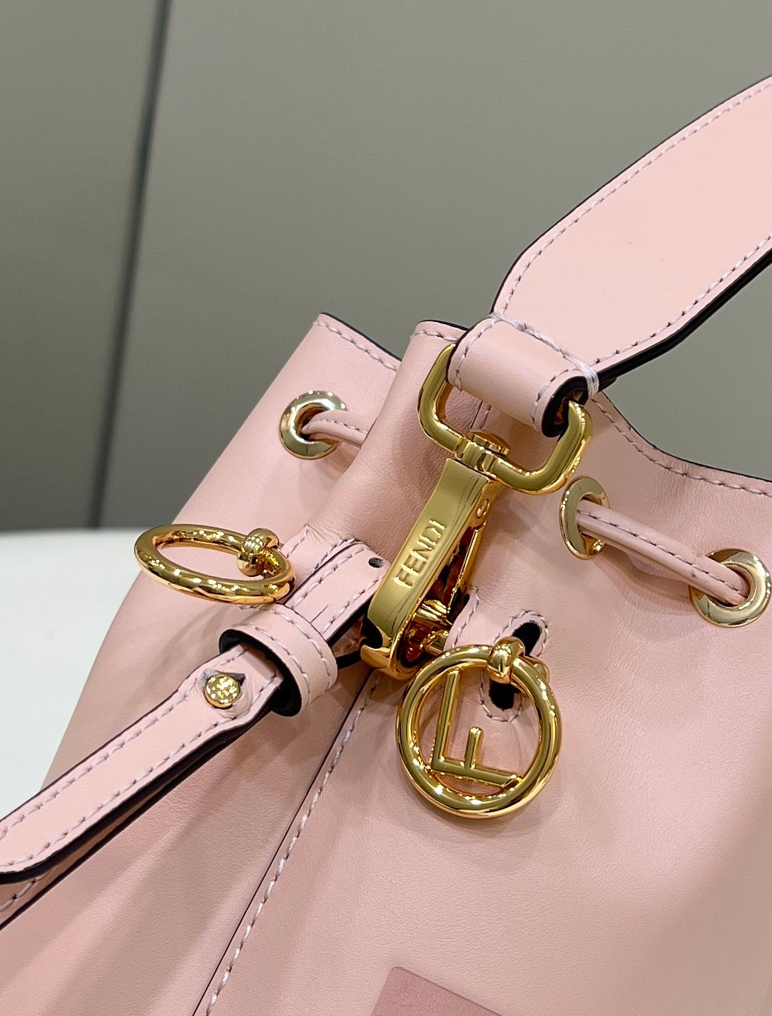 MON TRESOR MINI 18 BAG IN PEACHY PINK CALFSKIN FF WITH GOLD HARDWARE