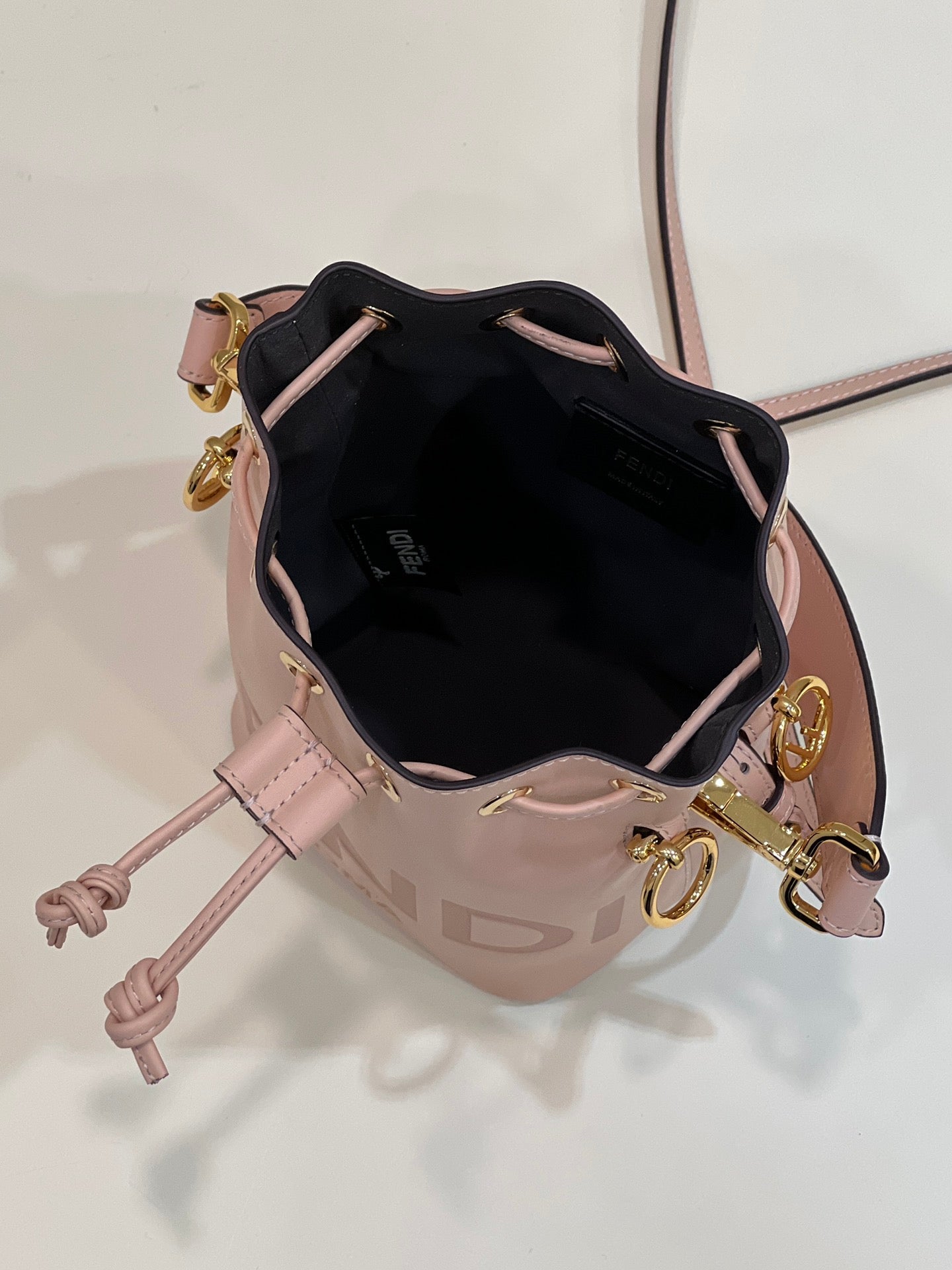 MON TRESOR MINI 18 BAG IN PEACHY PINK CALFSKIN FF WITH GOLD HARDWARE