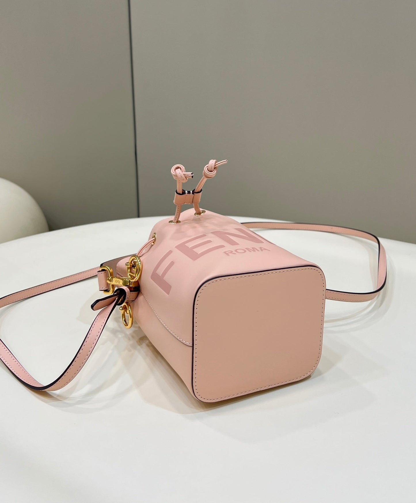 MON TRESOR MINI 18 BAG IN PEACHY PINK CALFSKIN FF WITH GOLD HARDWARE