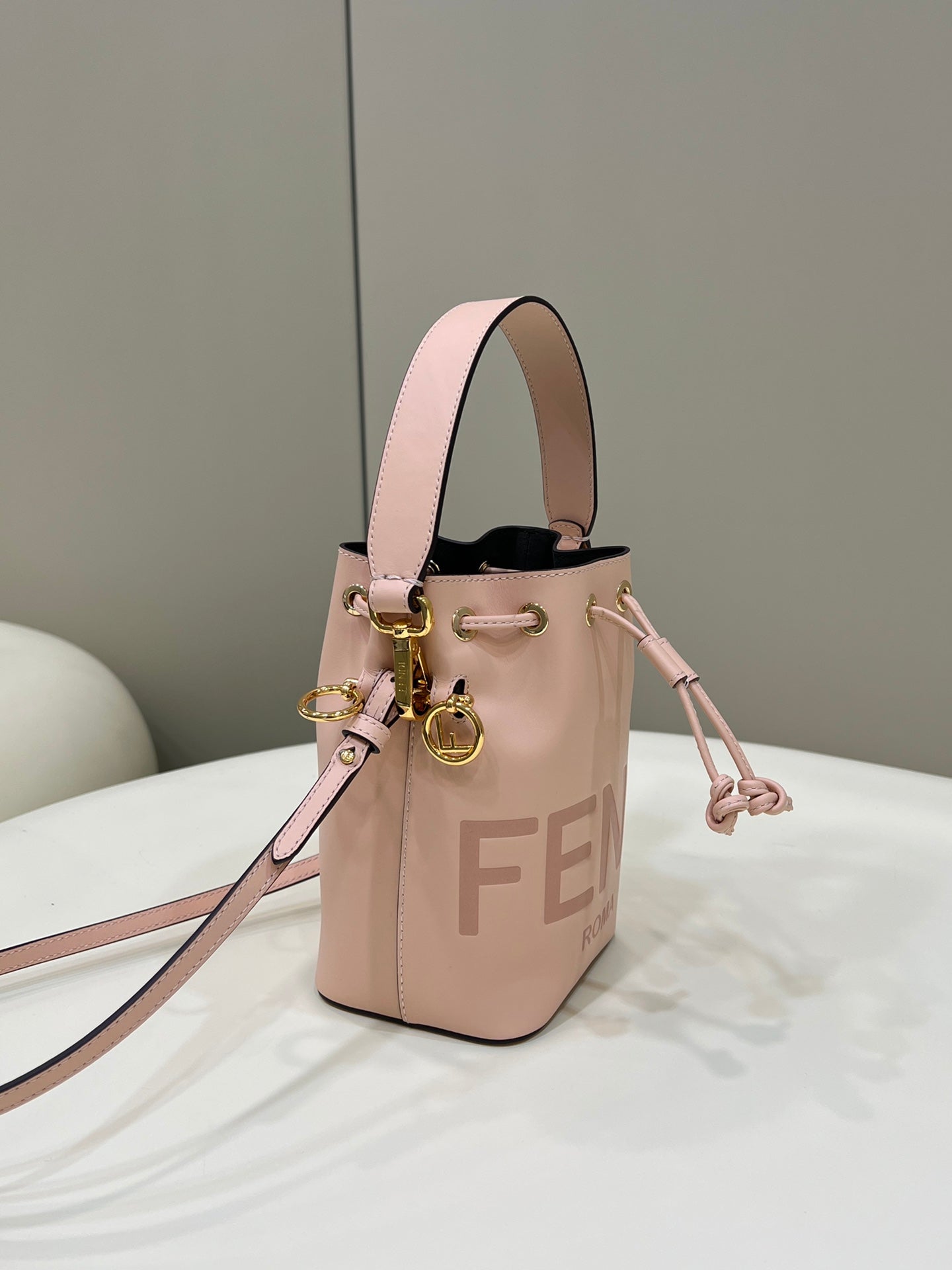 MON TRESOR MINI 18 BAG IN PEACHY PINK CALFSKIN FF WITH GOLD HARDWARE