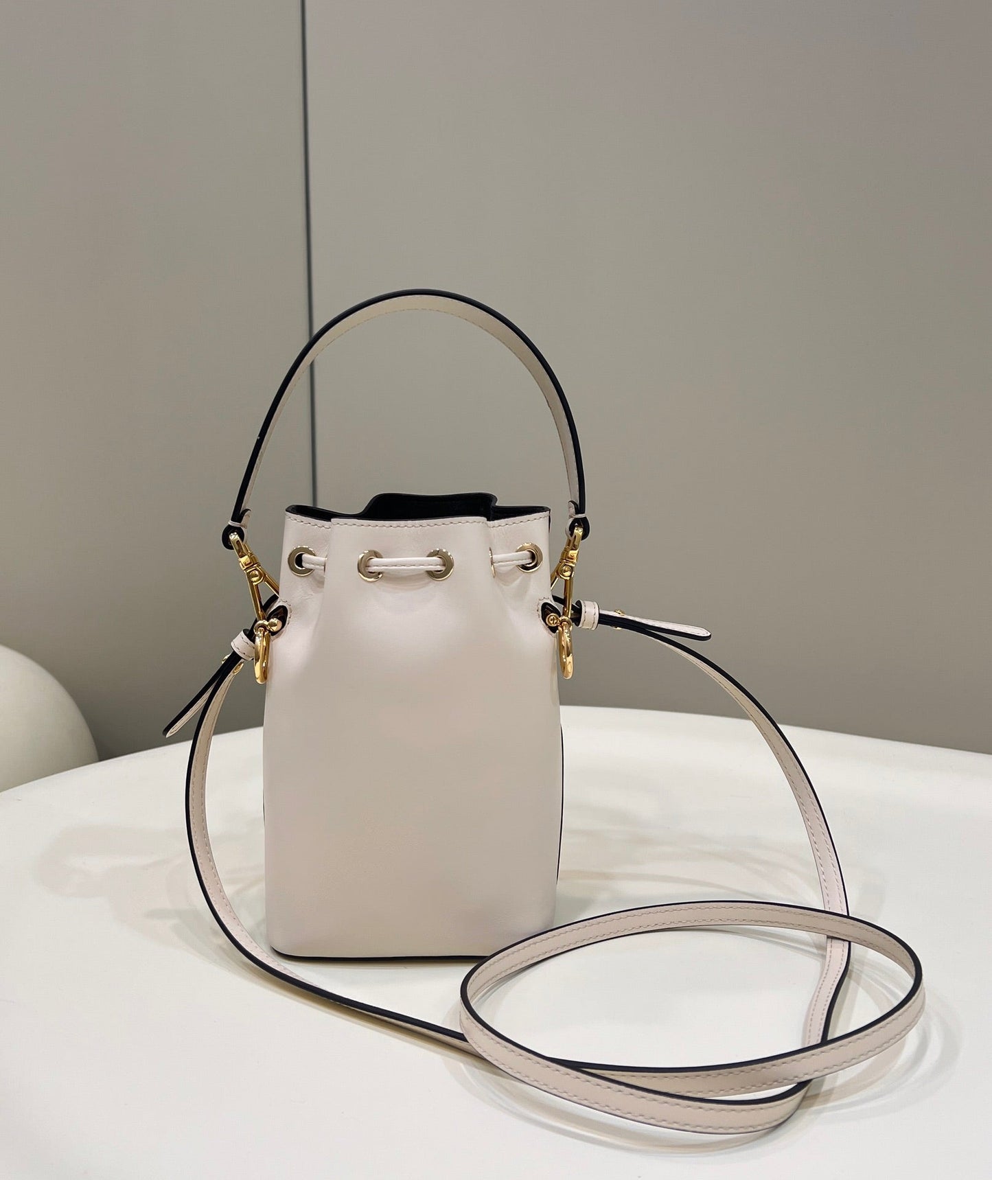 MON TRESOR MINI 18 BAG IN WHITE CALFSKIN FF WITH GOLD HARDWARE