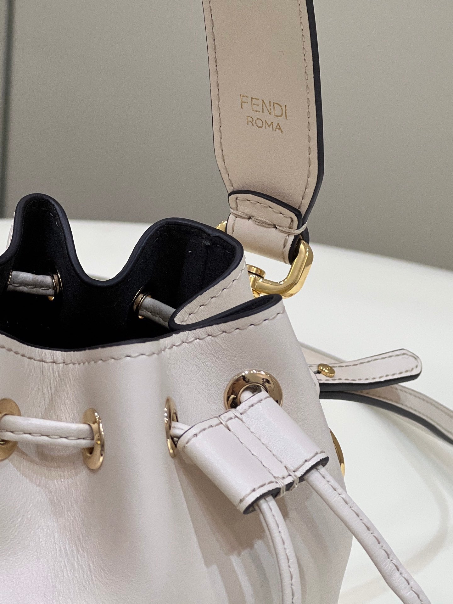 MON TRESOR MINI 18 BAG IN WHITE CALFSKIN FF WITH GOLD HARDWARE