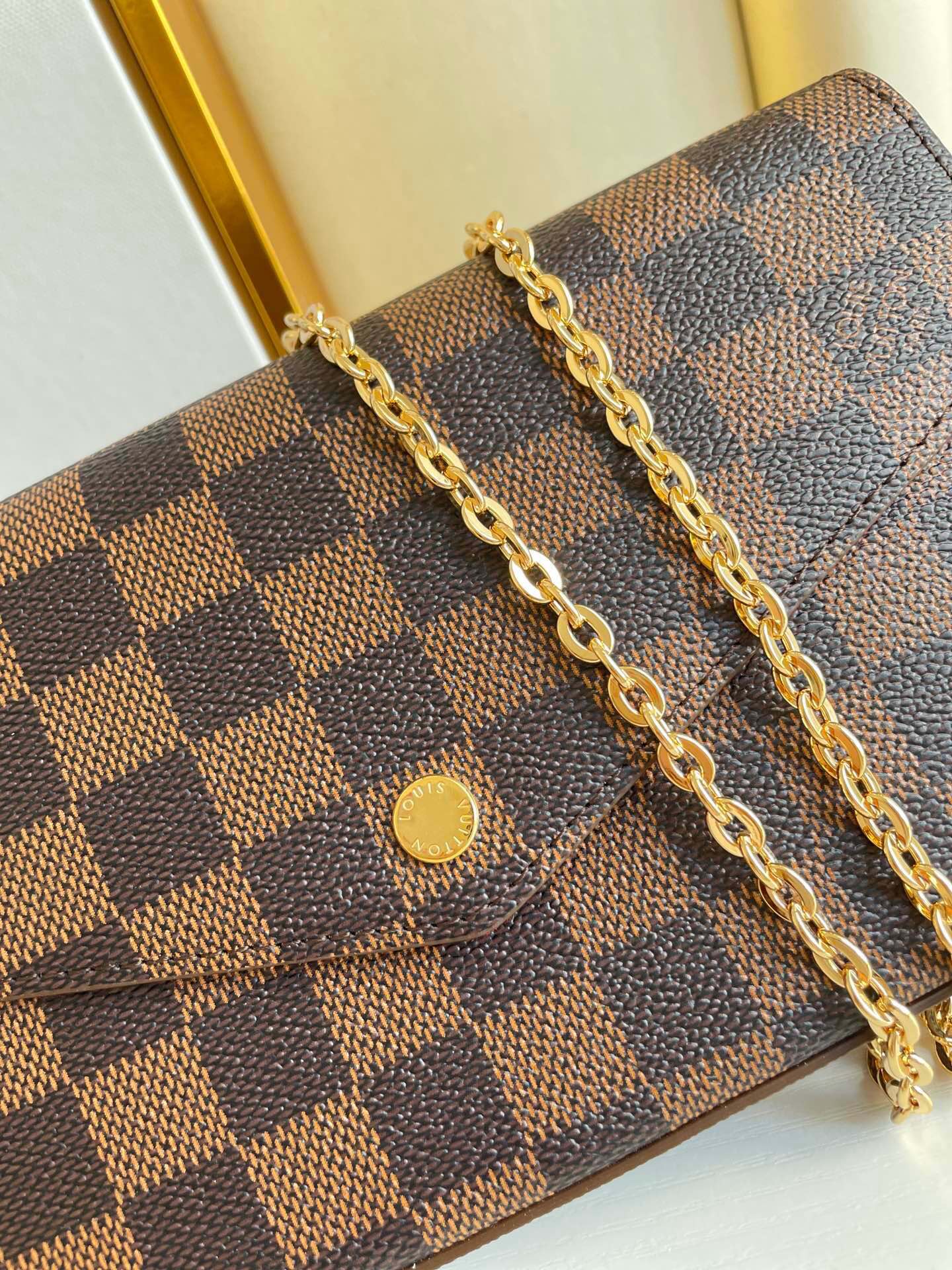 FÉLICIE POCHETTE 21 IN BROWN DAMIER EBENE COATED CANVAS GOLD HARDWARE