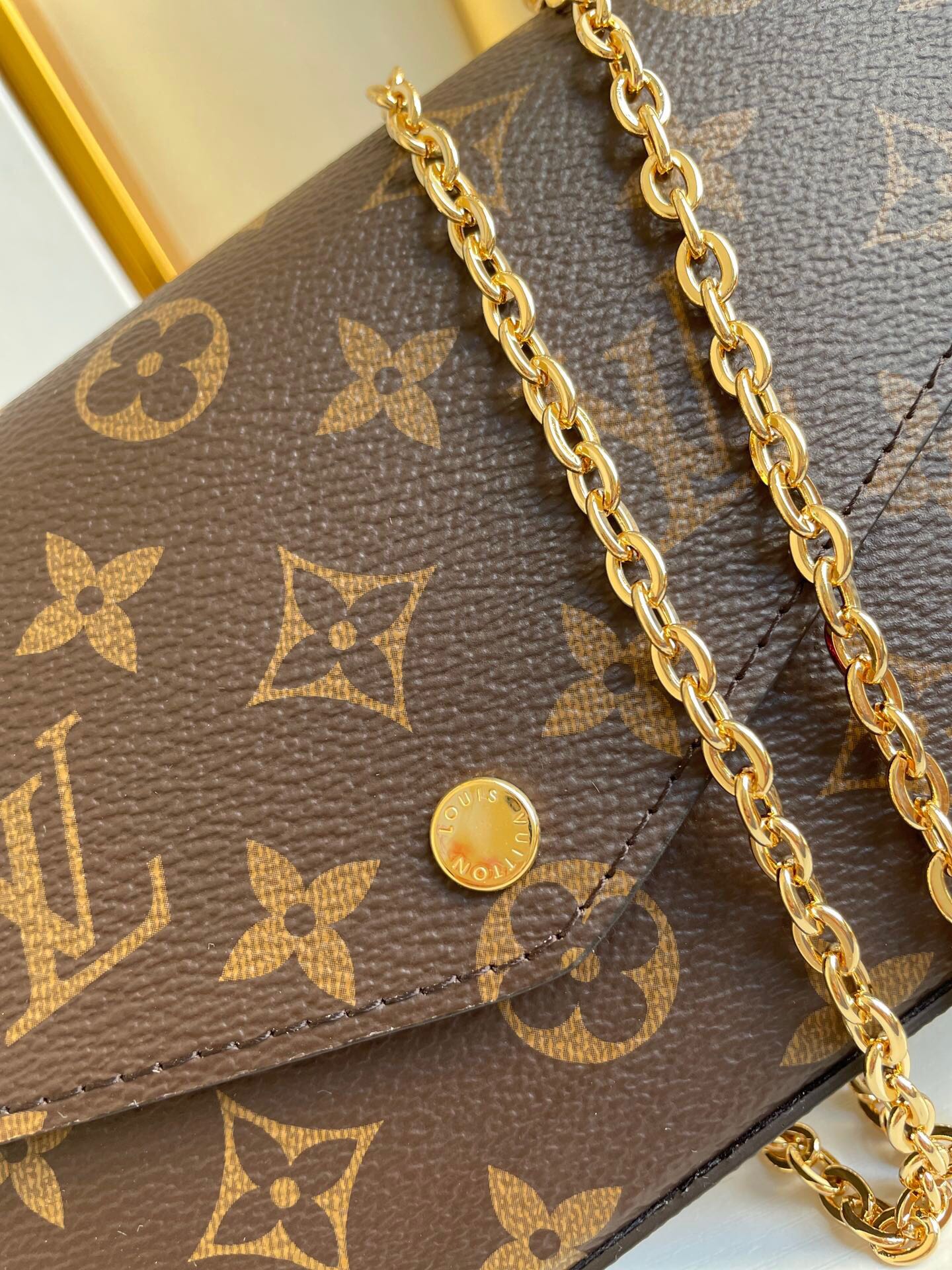 FÉLICIE POCHETTE 21 IN BROWN MONOGRAM CANVAS GOLD HARDWARE