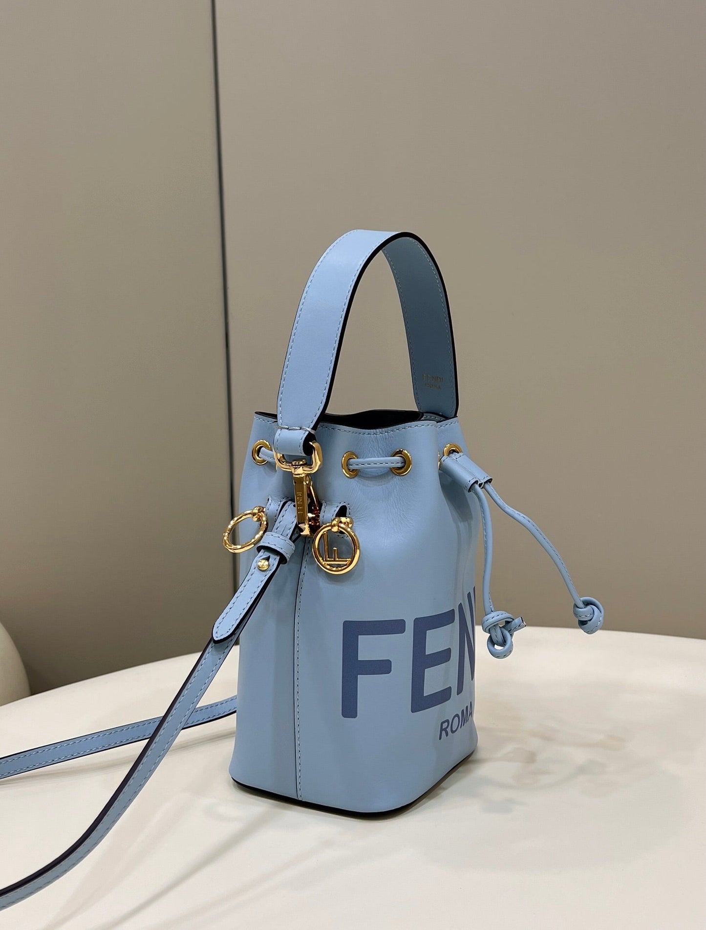 MON TRESOR MINI 18 BAG IN LIGHT BLUE CALFSKIN FF WITH GOLD HARDWARE