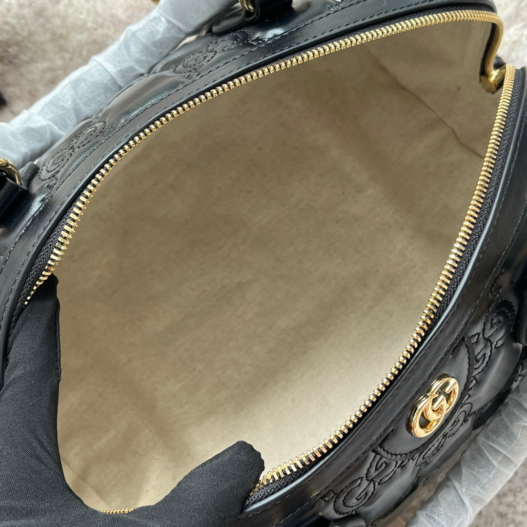 MATELASSÉ TOP HANDLE BAG 31 IN BLACK EMBOSSED CALFSKIN GOLD HARDWARE