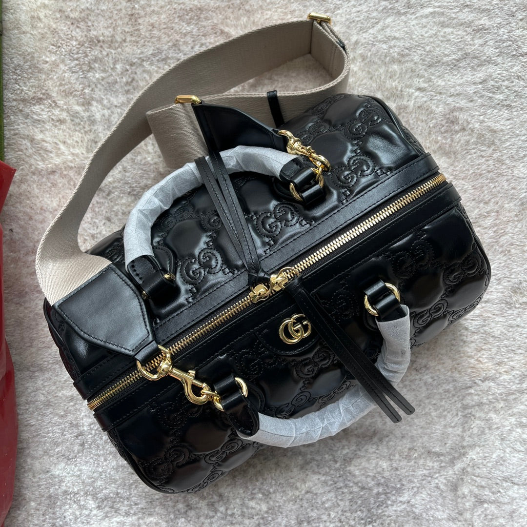 MATELASSÉ TOP HANDLE BAG 31 IN BLACK EMBOSSED CALFSKIN GOLD HARDWARE