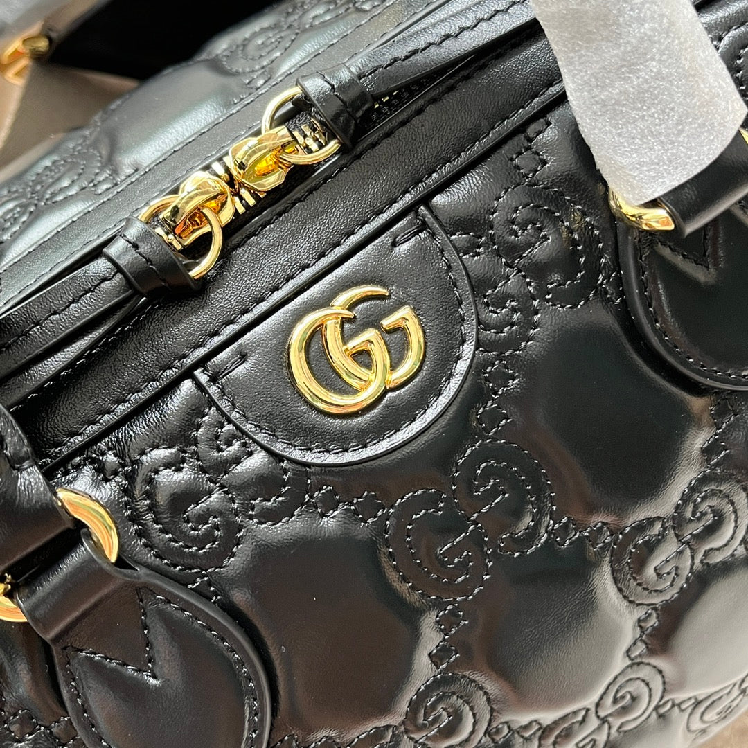 MATELASSÉ TOP HANDLE BAG 31 IN BLACK EMBOSSED CALFSKIN GOLD HARDWARE