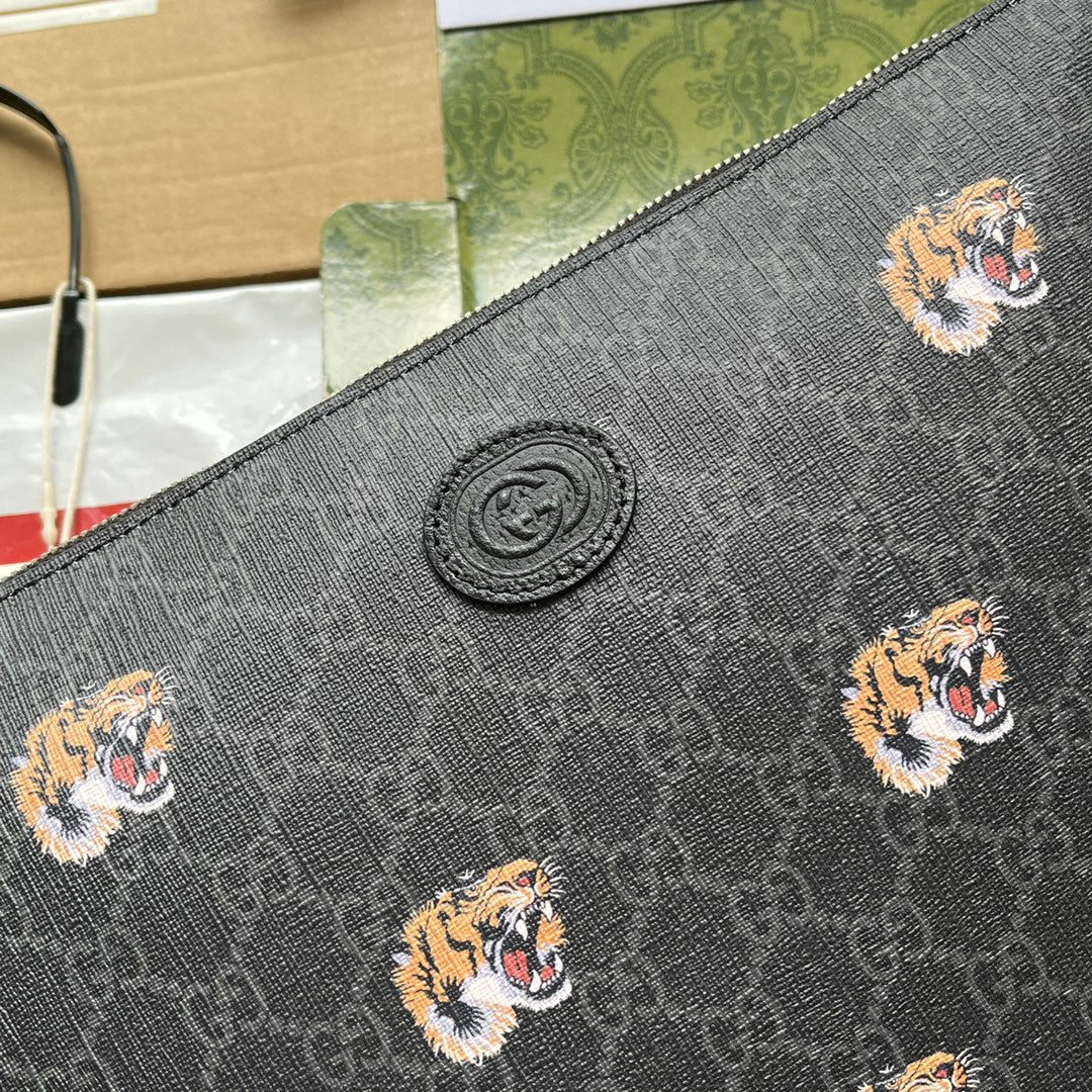 CLUTCH WITH TIGER PRINT 30 IN BLACK MONOGRAM CANVAS