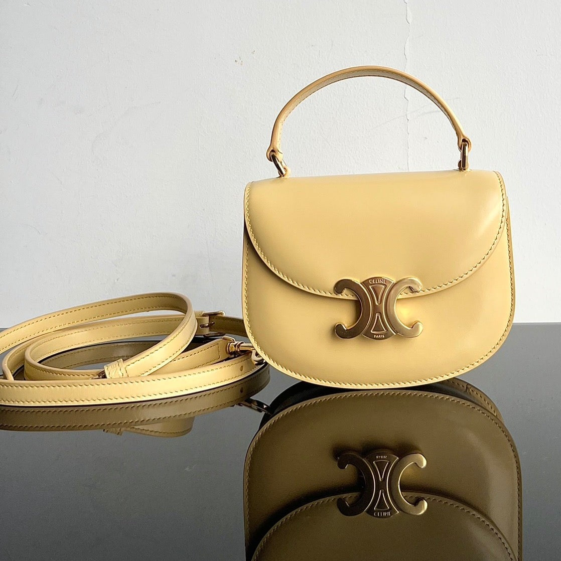 TRIOMPHE SHINY CALFSKIN HANDBAG 18 YELLOW PASTEL