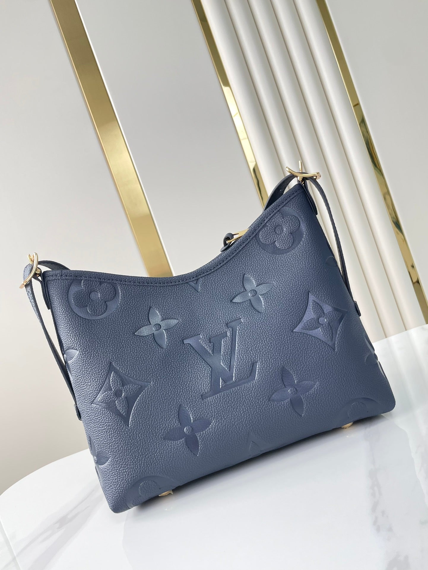 CARRYALL 29 IN DARK NAVY MONOGRAM EMPREINTE LEATHER