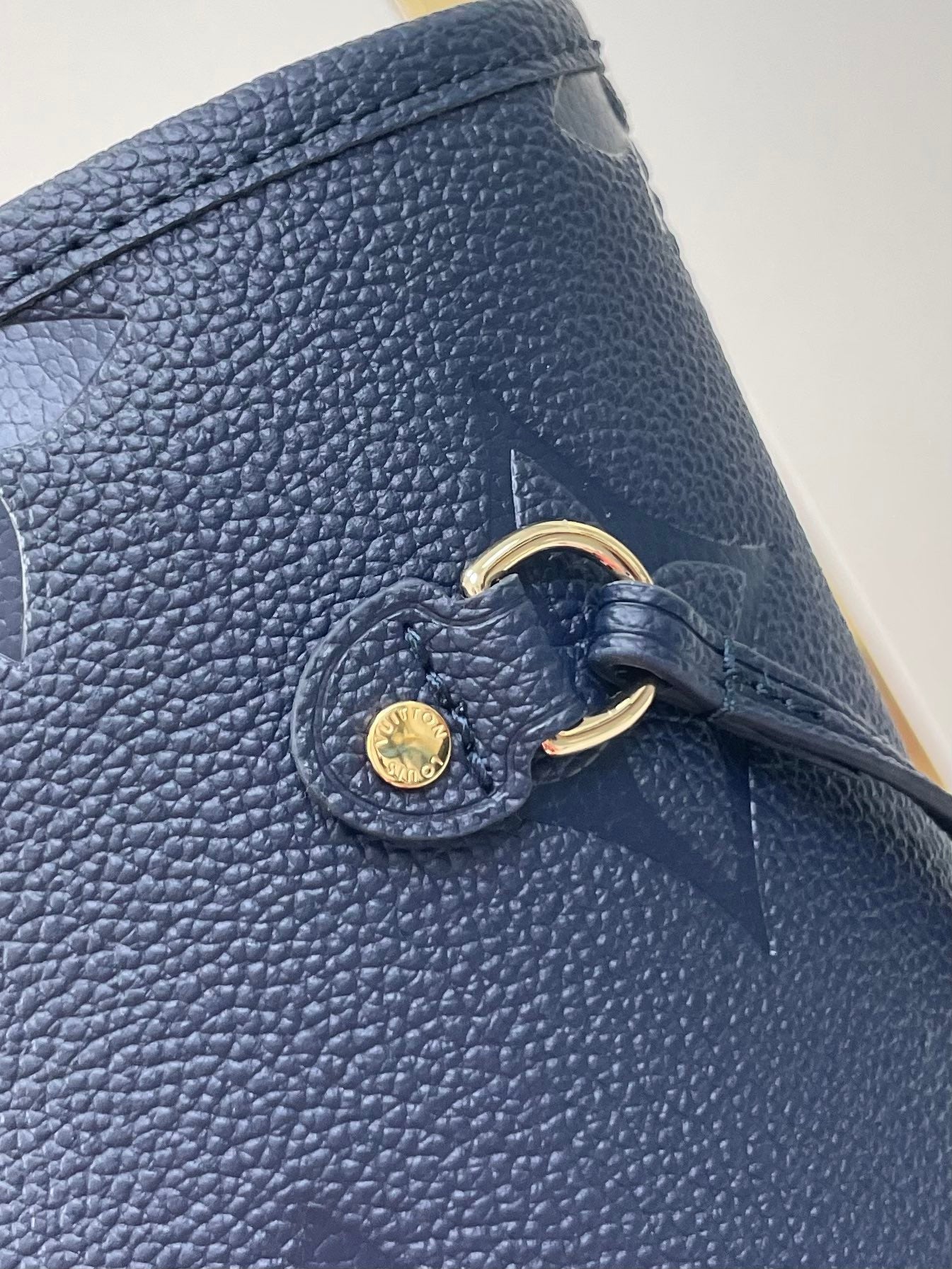 NEVERFULL MM 31 IN DARK NAVY MONOGRAM EMPREINTE LEATHER