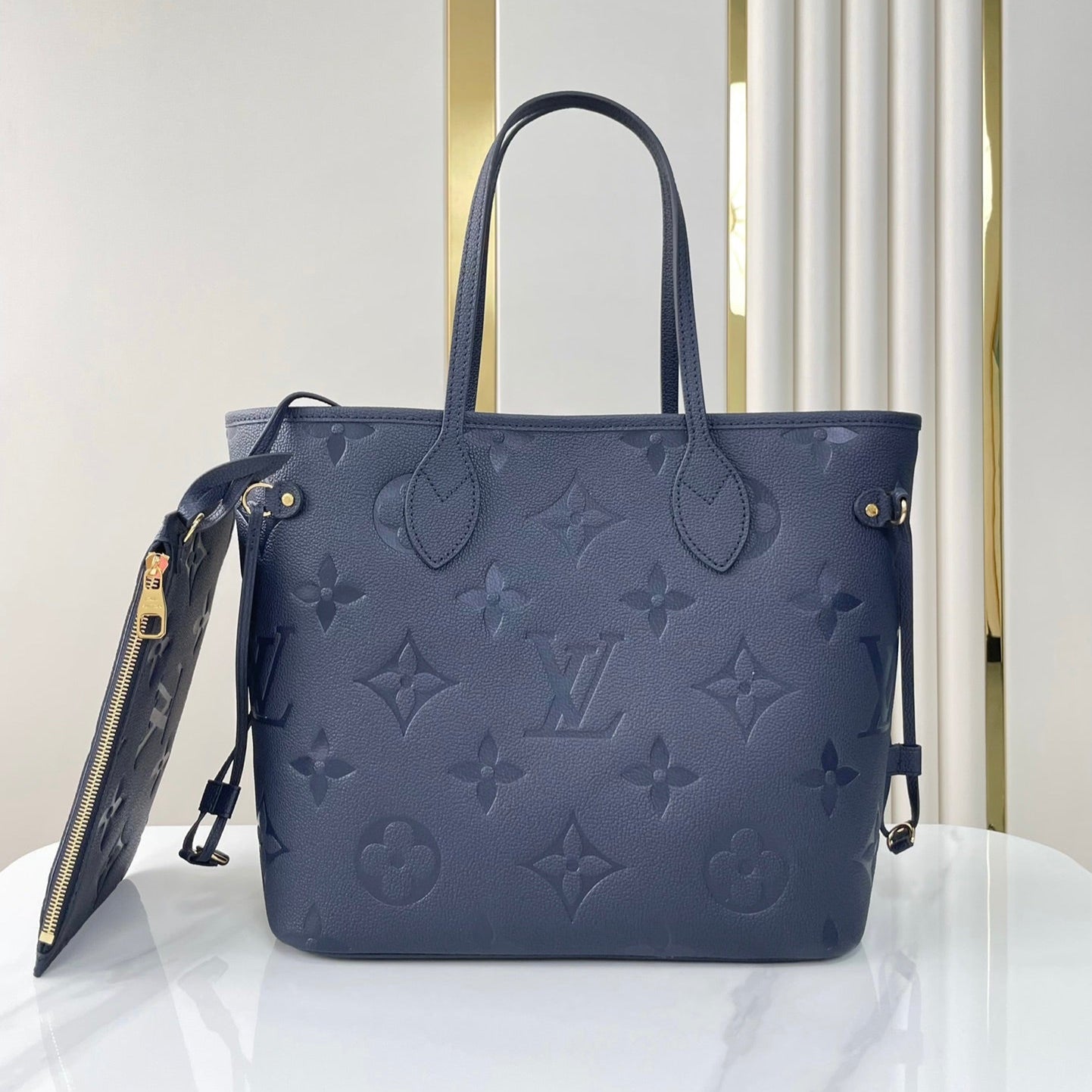 NEVERFULL MM 31 IN DARK NAVY MONOGRAM EMPREINTE LEATHER