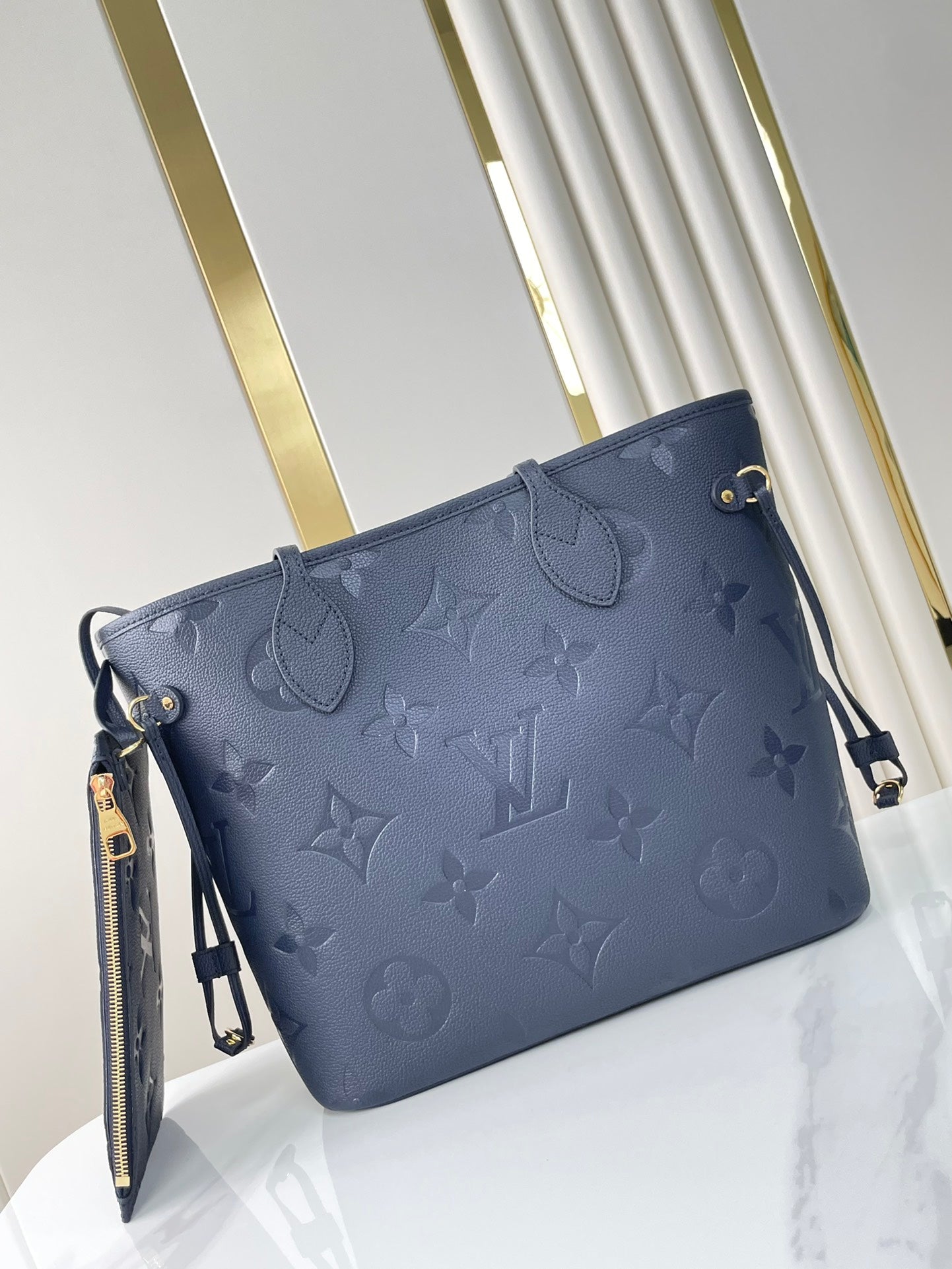 NEVERFULL MM 31 IN DARK NAVY MONOGRAM EMPREINTE LEATHER