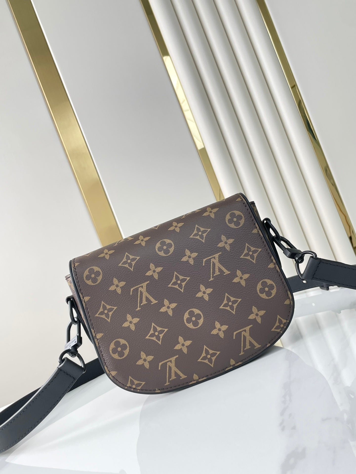 MONTSOURIS MESSENGER PM 20 IN BROWN MONOGRAM CANVAS