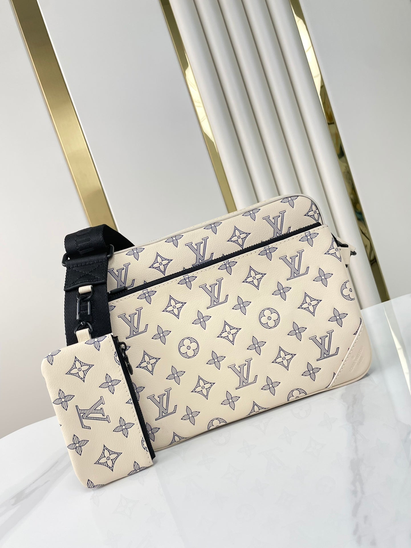 TRIO MESSENGER 25 IN CREAM BLUE MONOGRAM SHADOW CALFSKIN