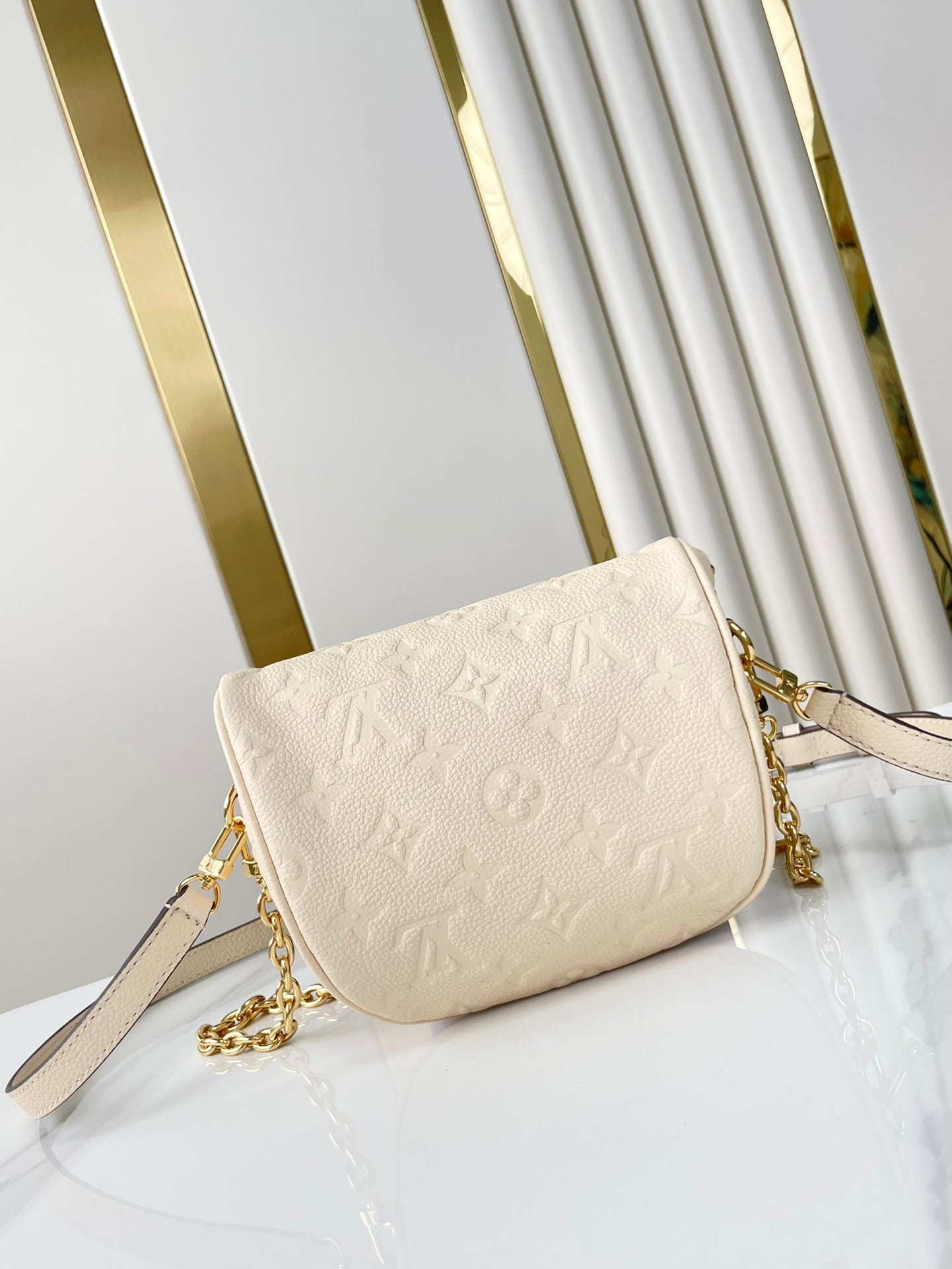 MINI BUMBAG 17 IN CREAM MONOGRAM EMPREINTE LEATHER GOLD HARDWARE