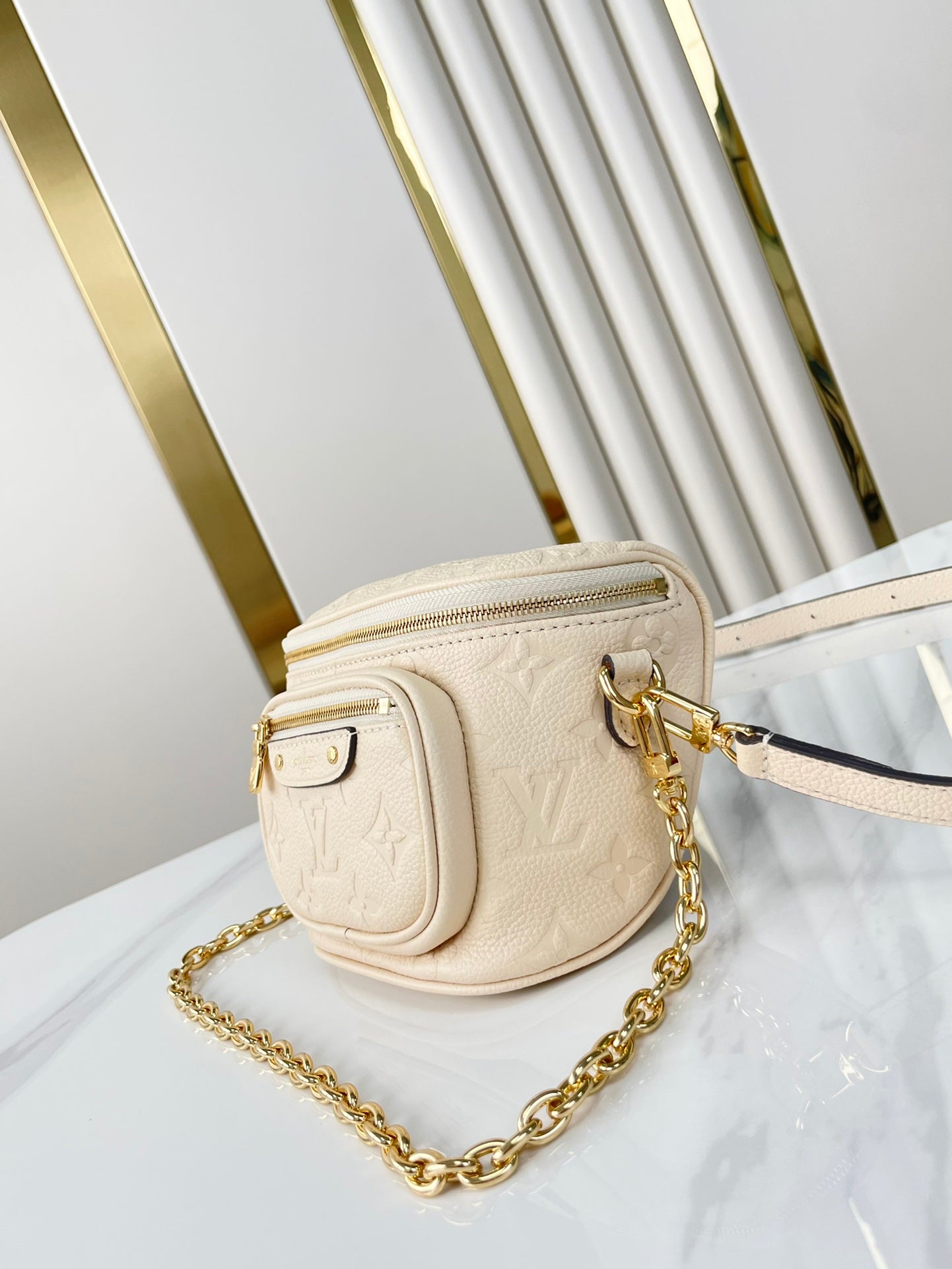 MINI BUMBAG 17 IN CREAM MONOGRAM EMPREINTE LEATHER GOLD HARDWARE