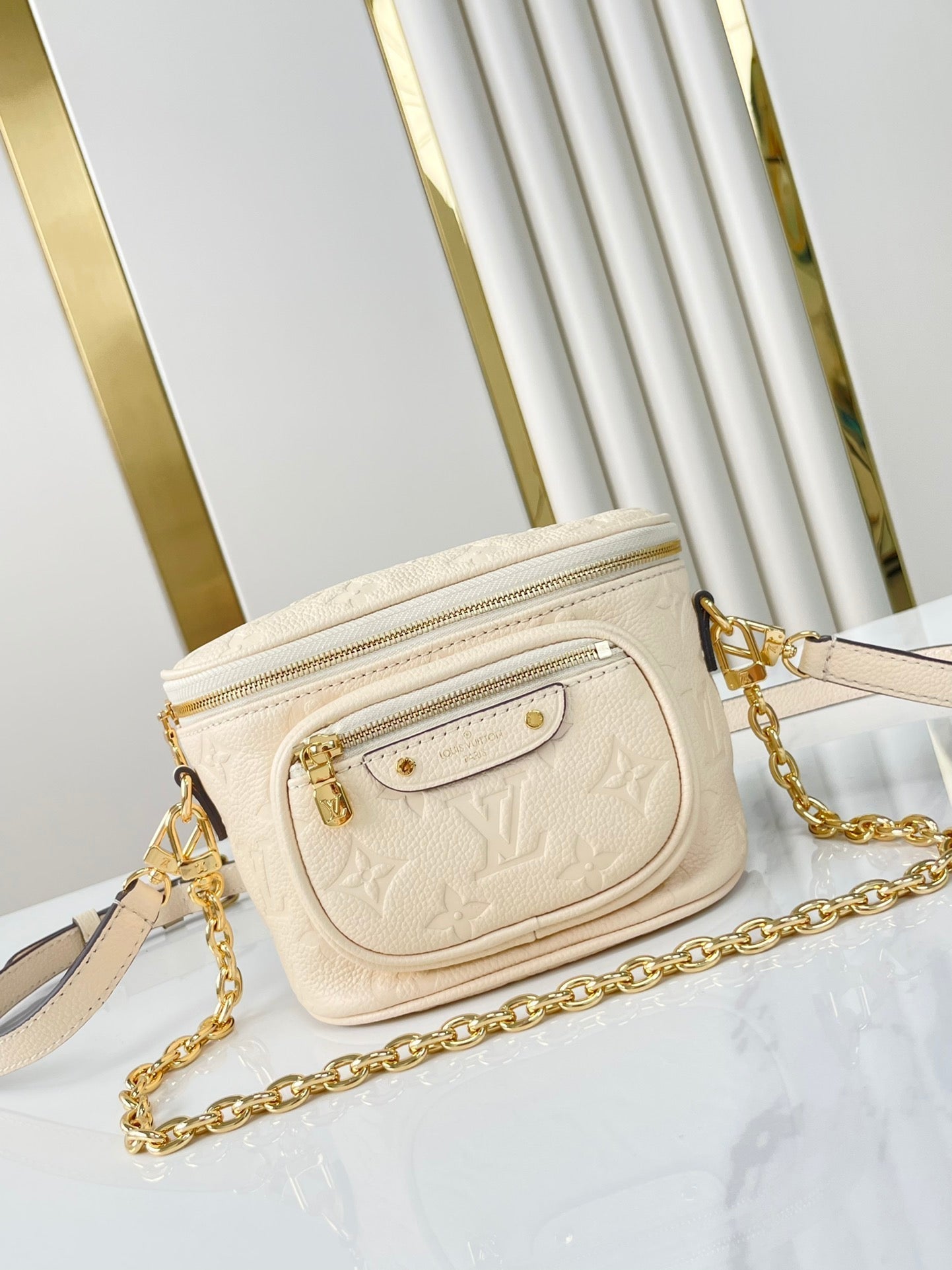 MINI BUMBAG 17 IN CREAM MONOGRAM EMPREINTE LEATHER GOLD HARDWARE