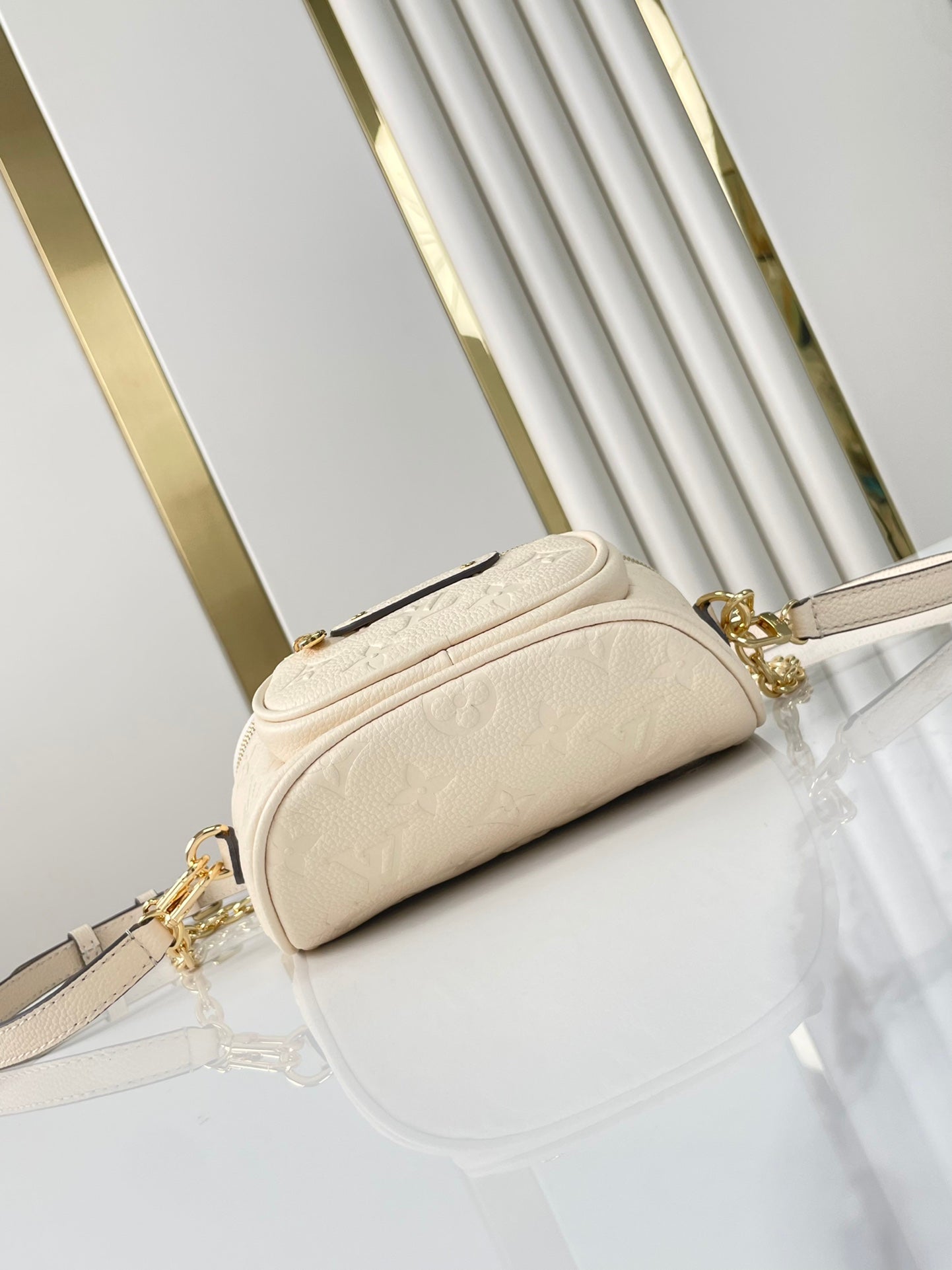 MINI BUMBAG 17 IN CREAM MONOGRAM EMPREINTE LEATHER GOLD HARDWARE