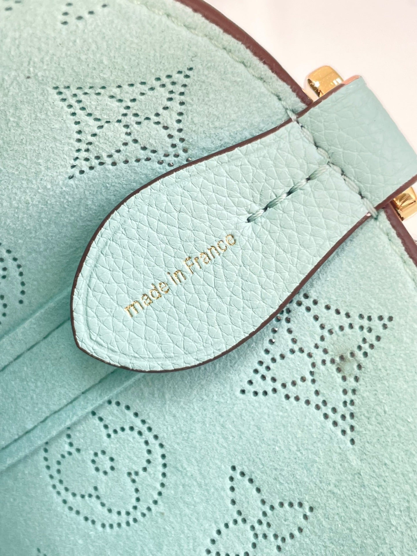 BLOSSOM PM 20 IN SKY BLUE MONOGRAM PERFORATED CALFSKIN