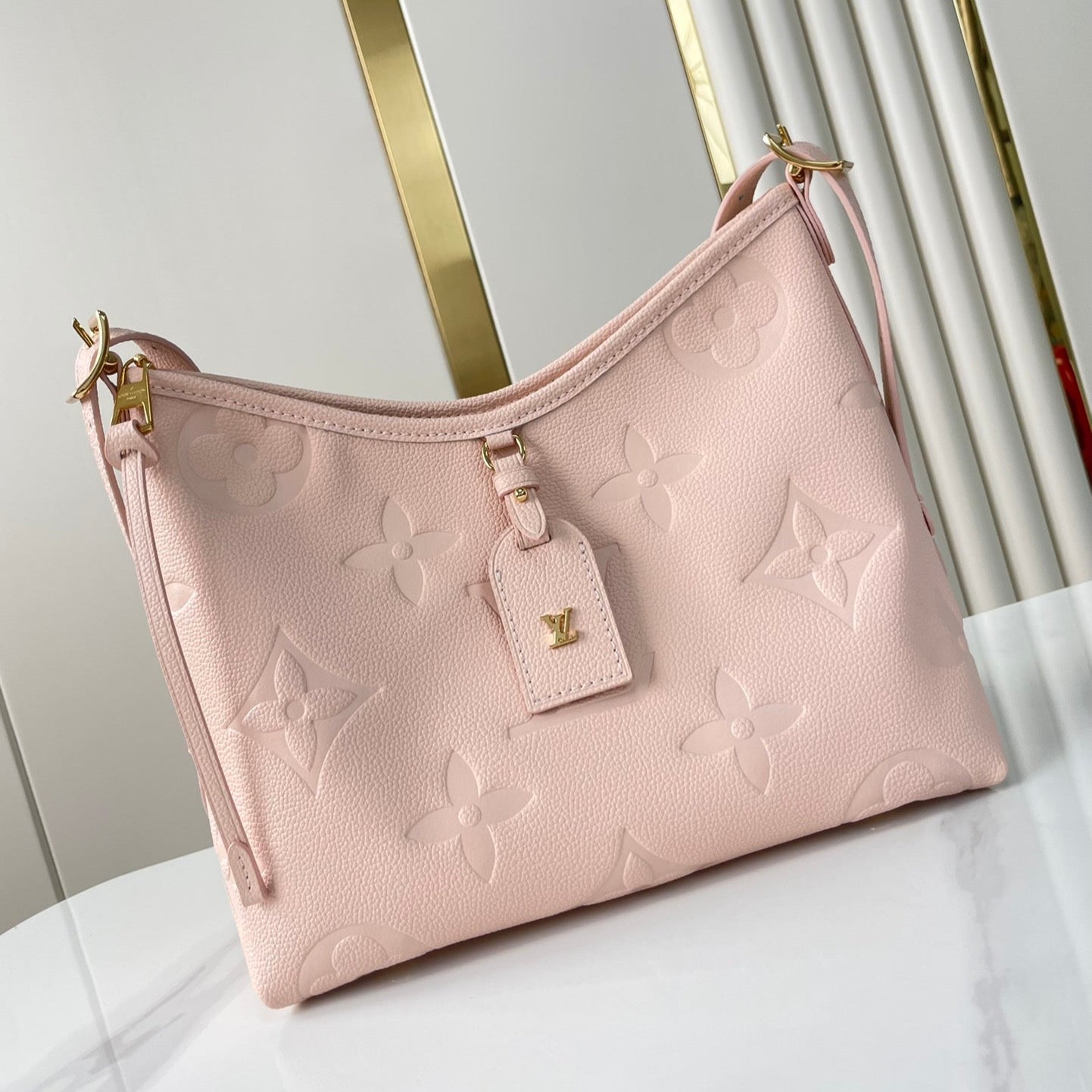 CARRYALL 29 IN LIGHT PINK MONOGRAM EMPREINTE LEATHER