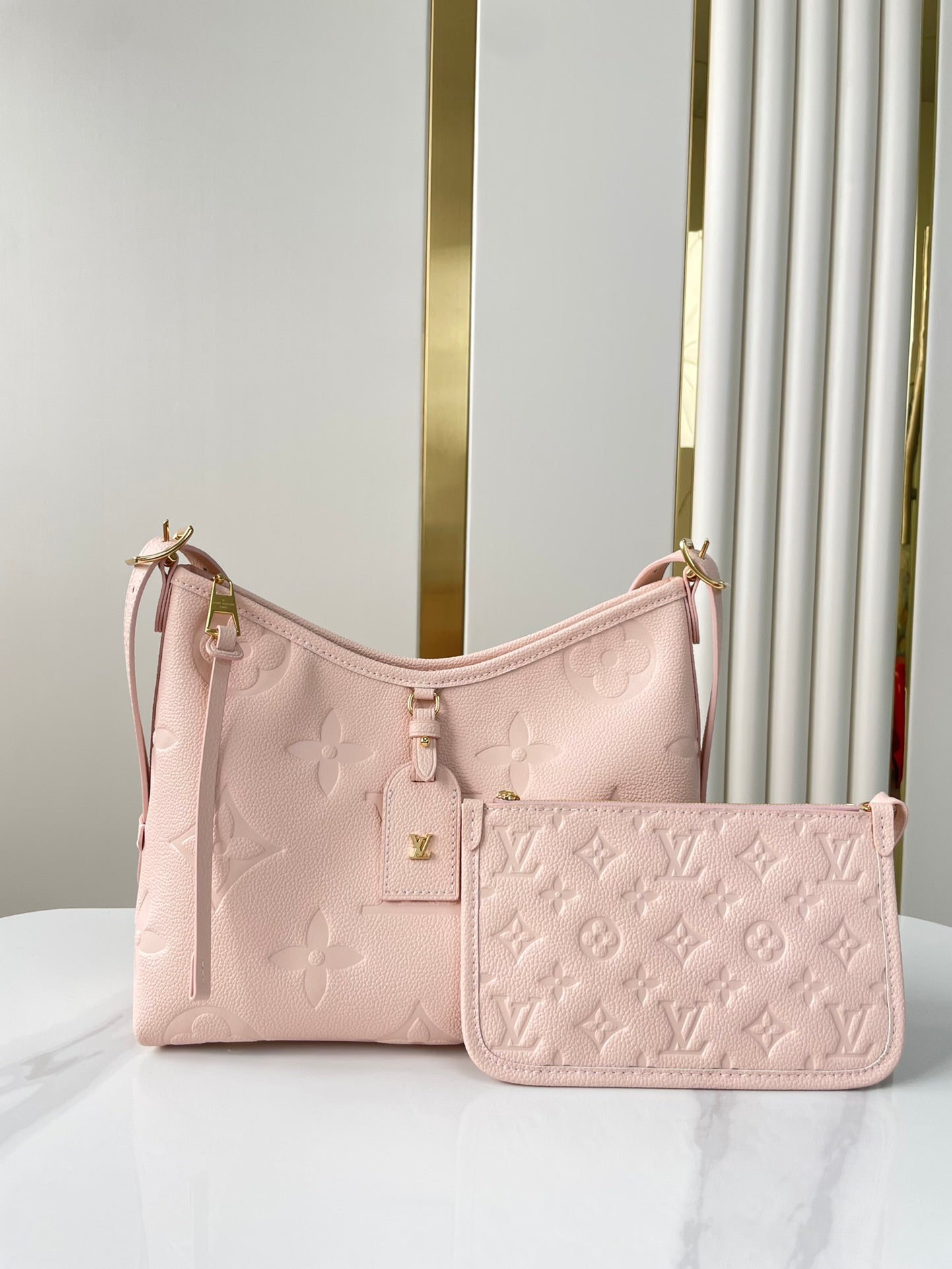 CARRYALL 29 IN LIGHT PINK MONOGRAM EMPREINTE LEATHER