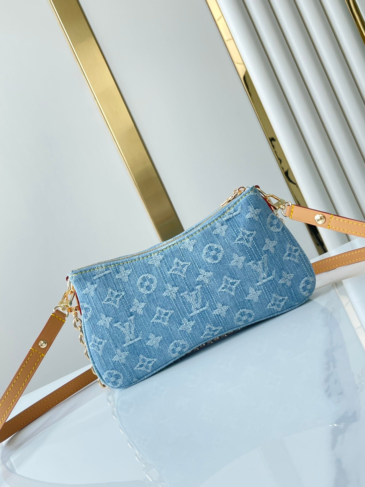 LIV POCHETTE 24 IN BLUE MONOGRAM DENIM GOLD HARDWARE