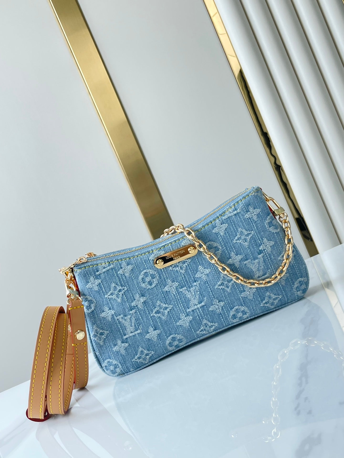 LIV POCHETTE 24 IN BLUE MONOGRAM DENIM GOLD HARDWARE