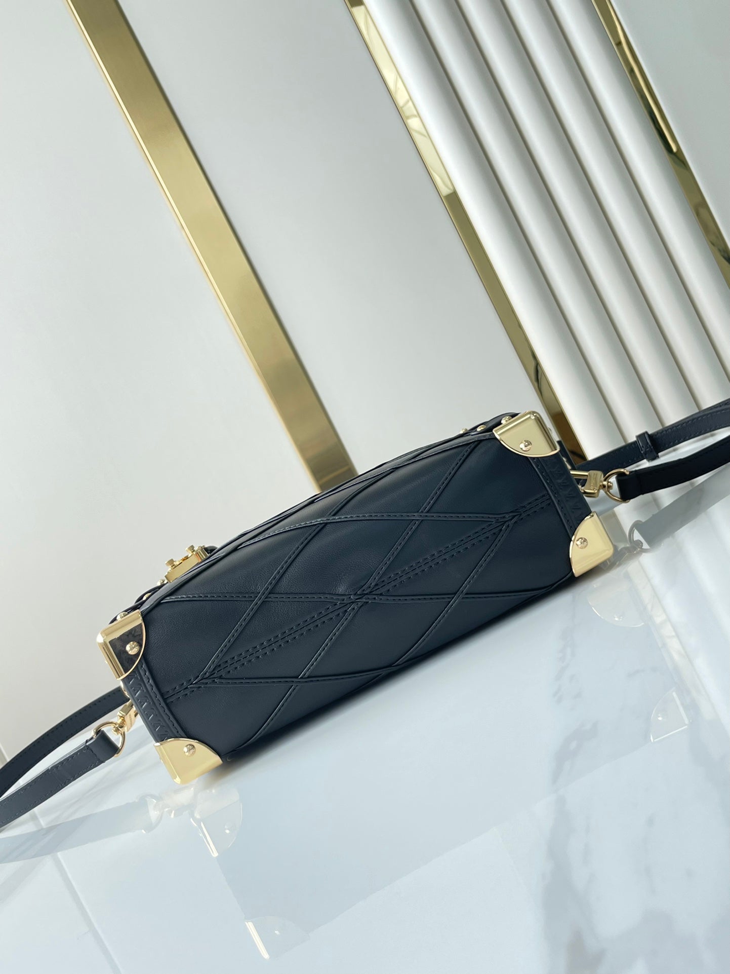 SIDE TRUNK 21 IN BLACK LAMBSKIN WITH CRISS CROSS PATTERN GOLD HARDWARE