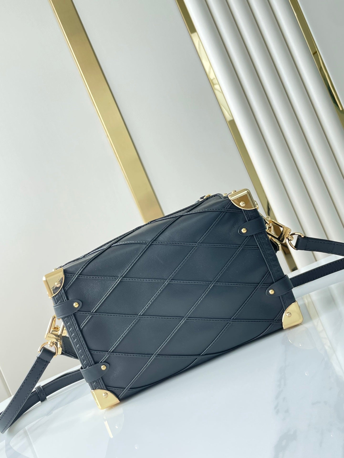 SIDE TRUNK 21 IN BLACK LAMBSKIN WITH CRISS CROSS PATTERN GOLD HARDWARE