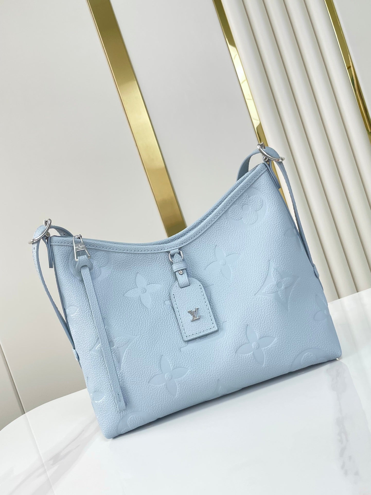 CARRYALL PM 29 IN BEAU BLUE MONOGRAM EMPREINTE LEATHER