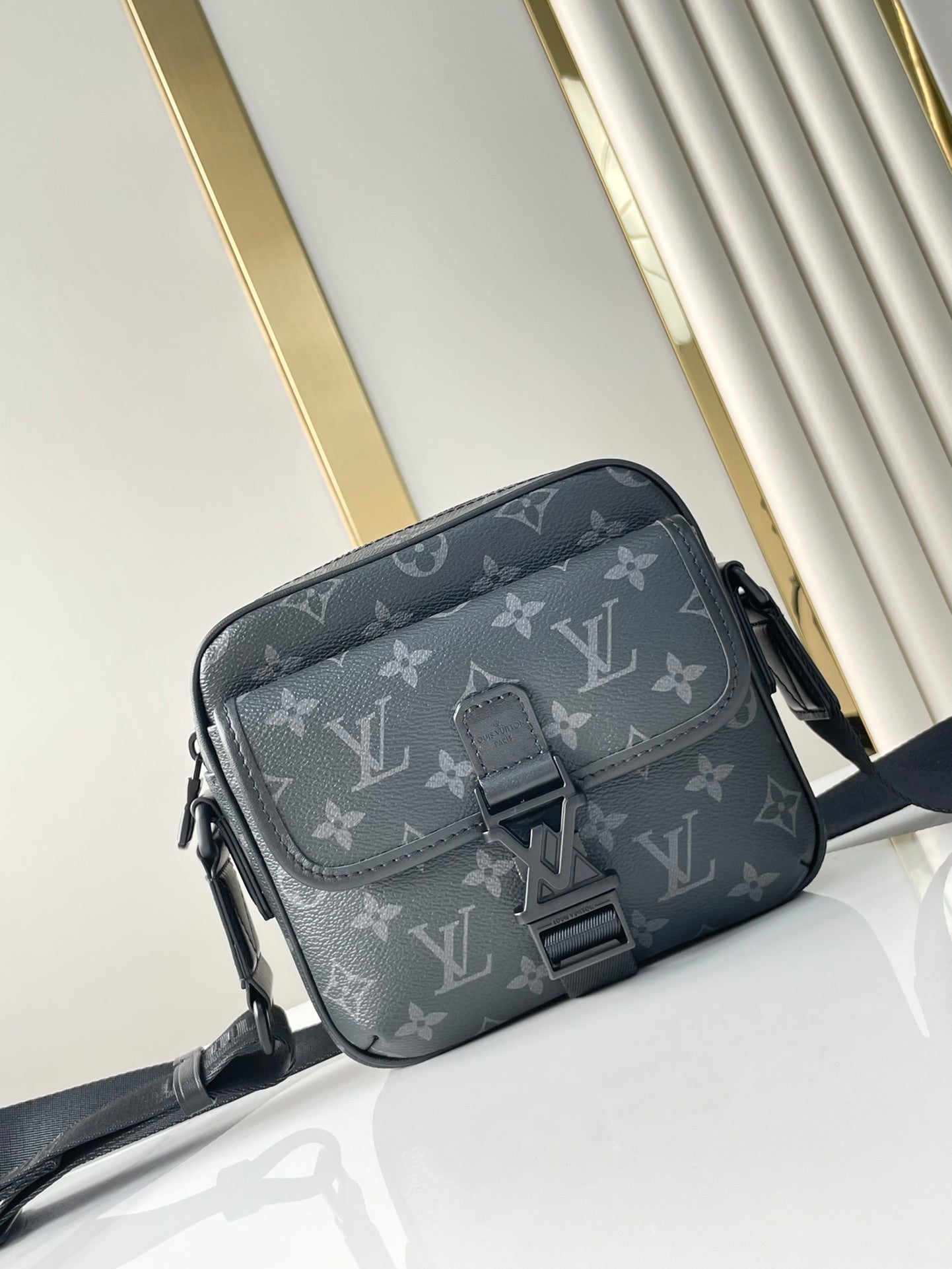 GETAWAY MESSENGER 18 IN GUN METAL MONOGRAM ECLIPSE CANVAS