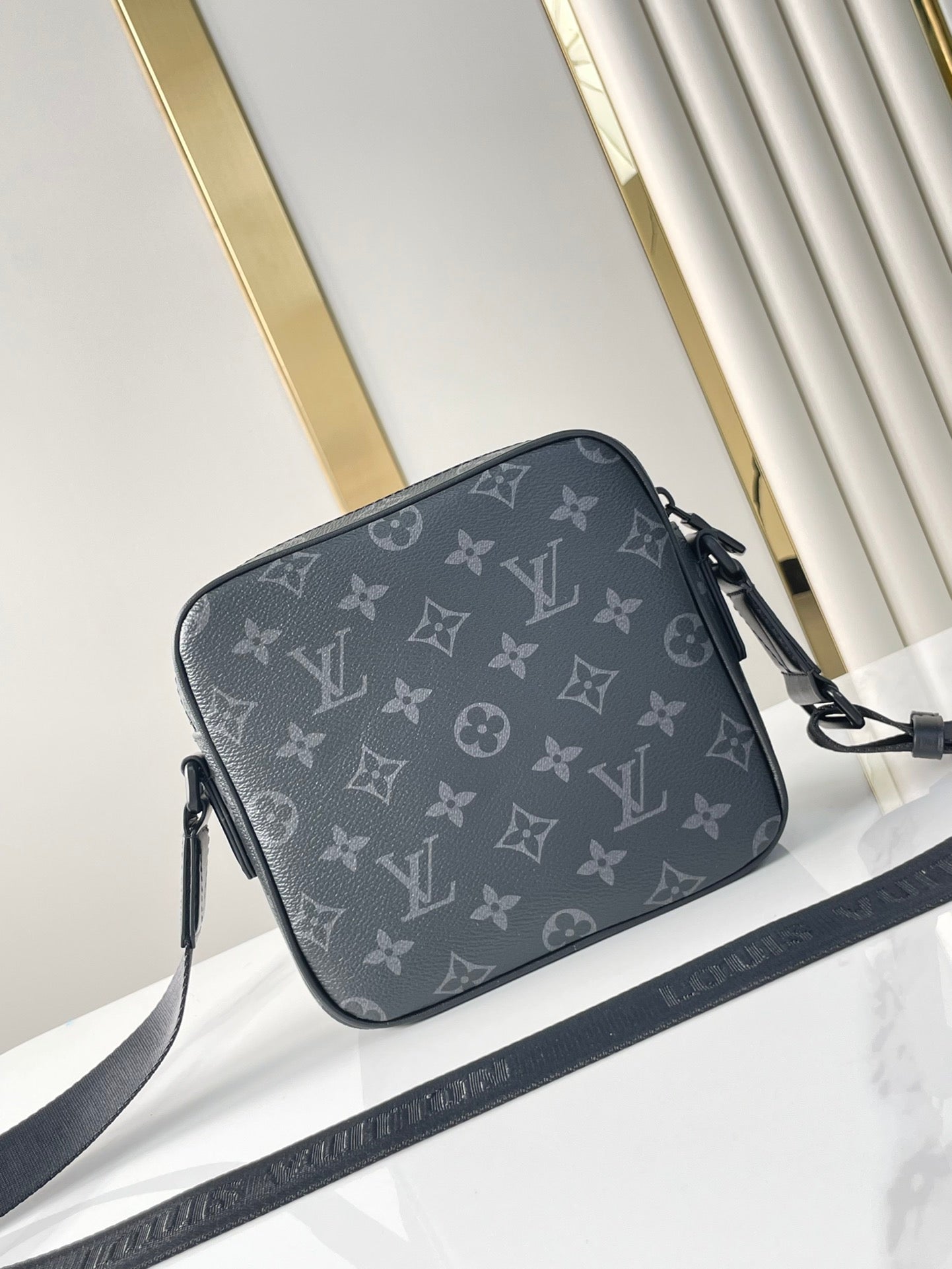 GETAWAY MESSENGER 18 IN GUN METAL MONOGRAM ECLIPSE CANVAS