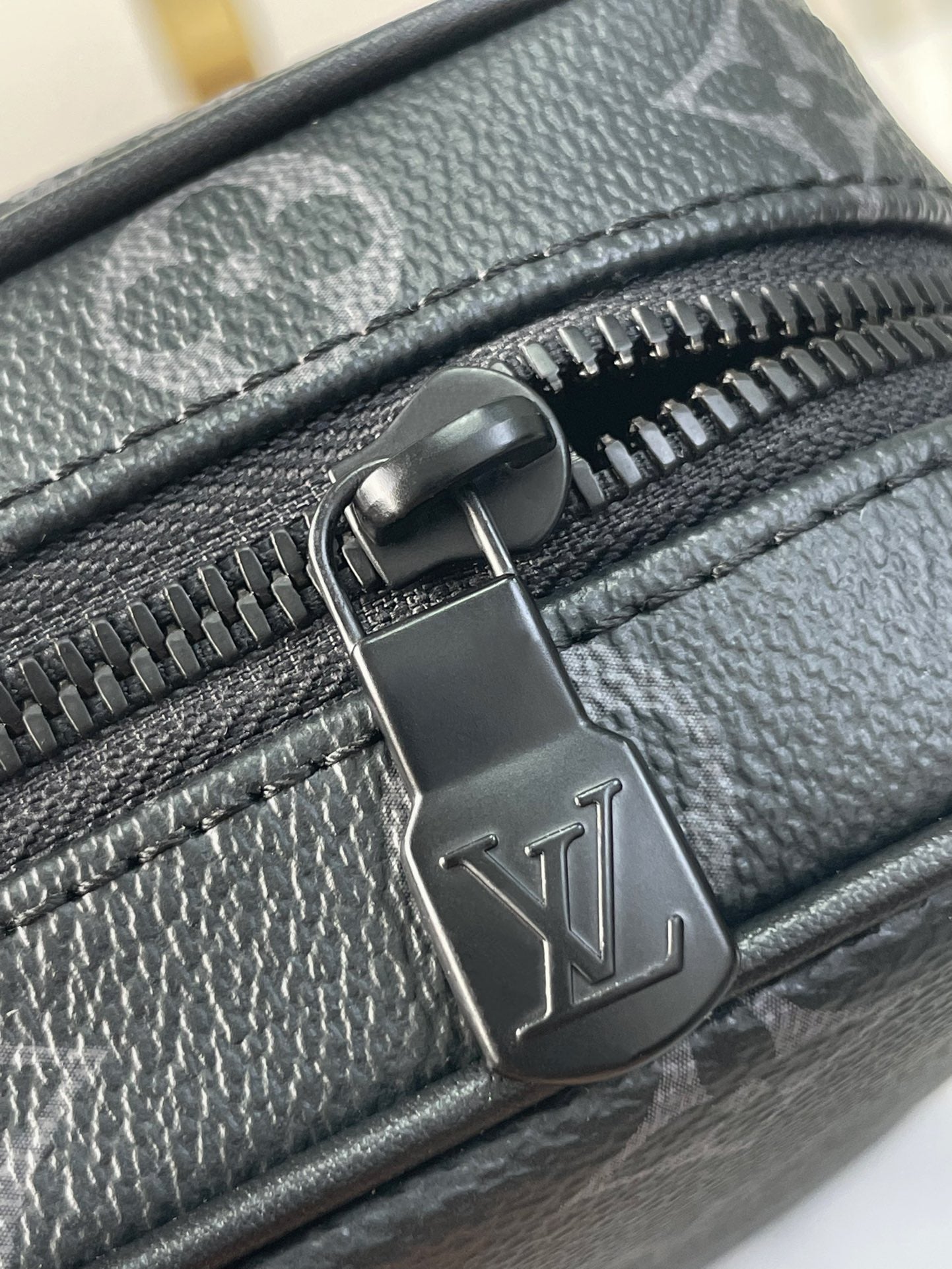 GETAWAY MESSENGER 18 IN GUN METAL MONOGRAM ECLIPSE CANVAS