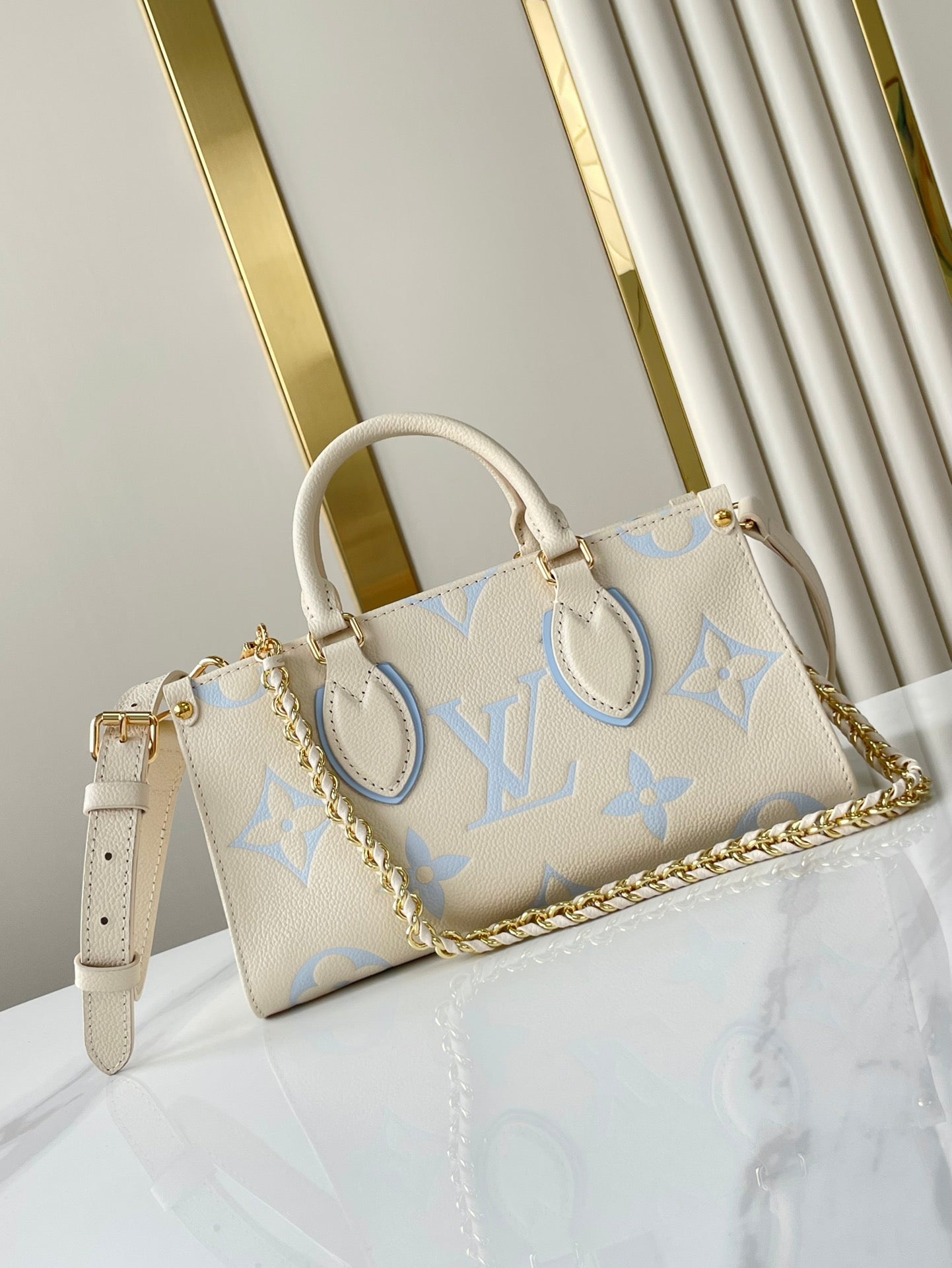 ONTHEGO 25 IN CREAM BLUE CALFSKIN GOLD HARDWARE