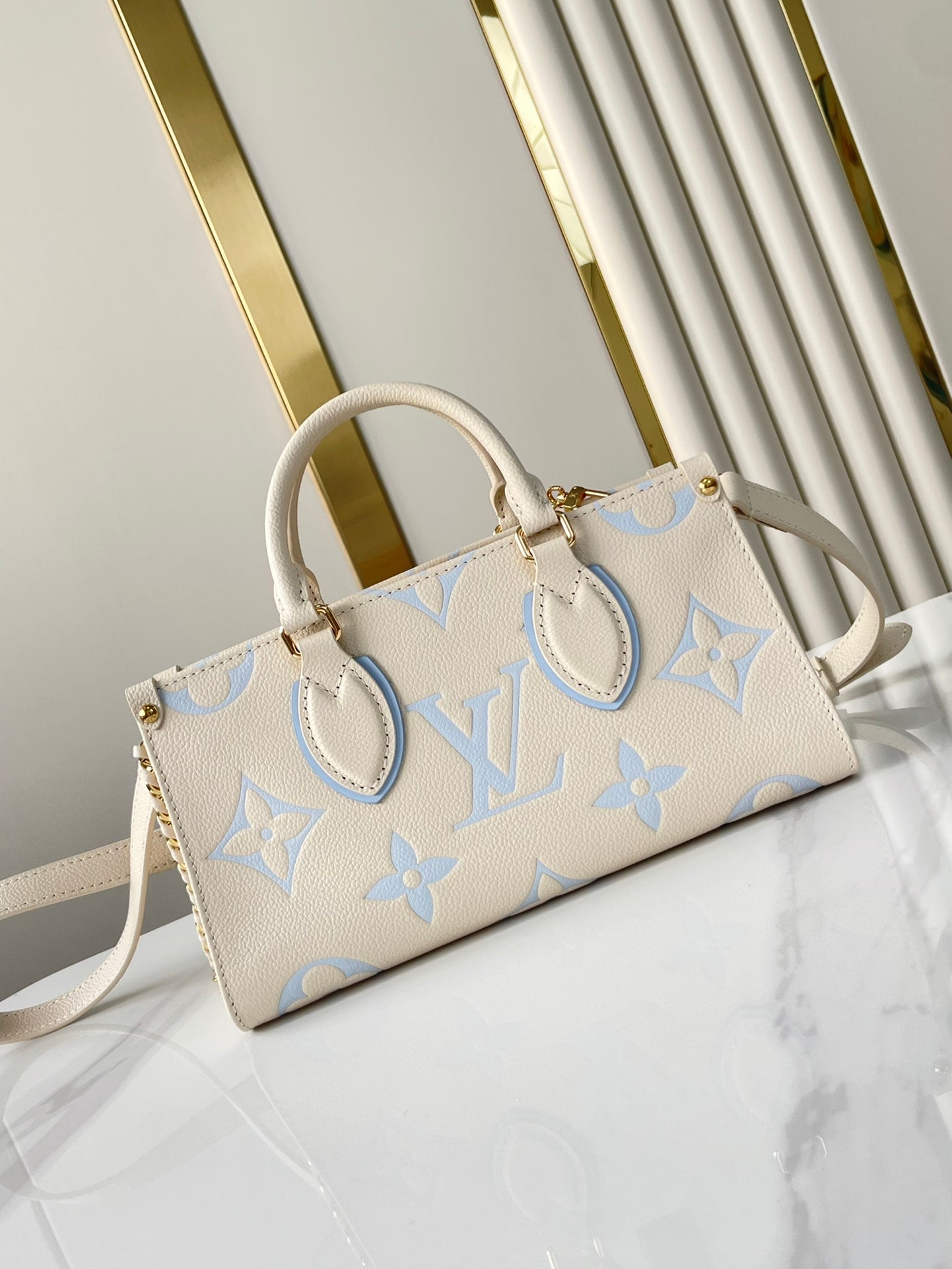 ONTHEGO 25 IN CREAM BLUE CALFSKIN GOLD HARDWARE