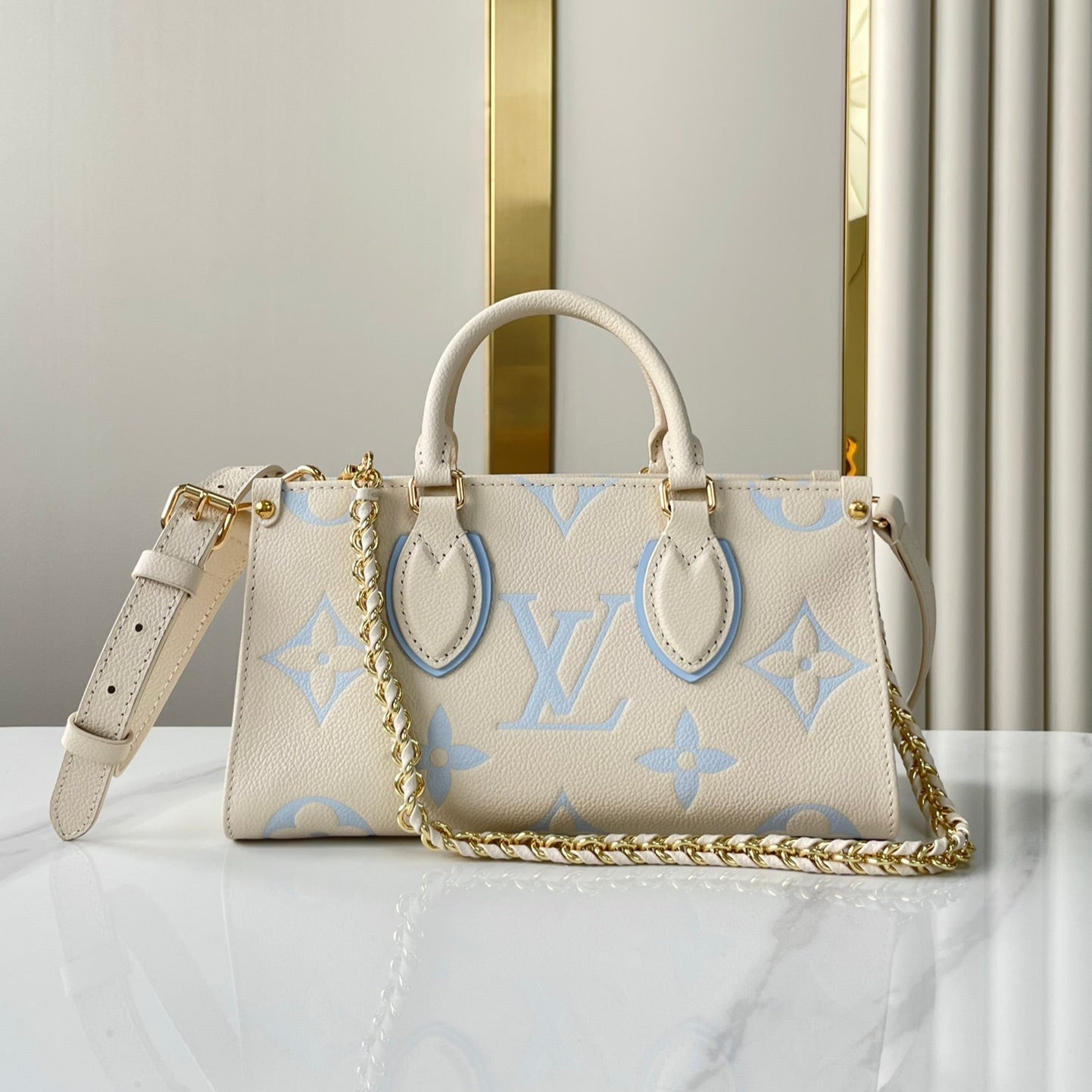 ONTHEGO 25 IN CREAM BLUE CALFSKIN GOLD HARDWARE