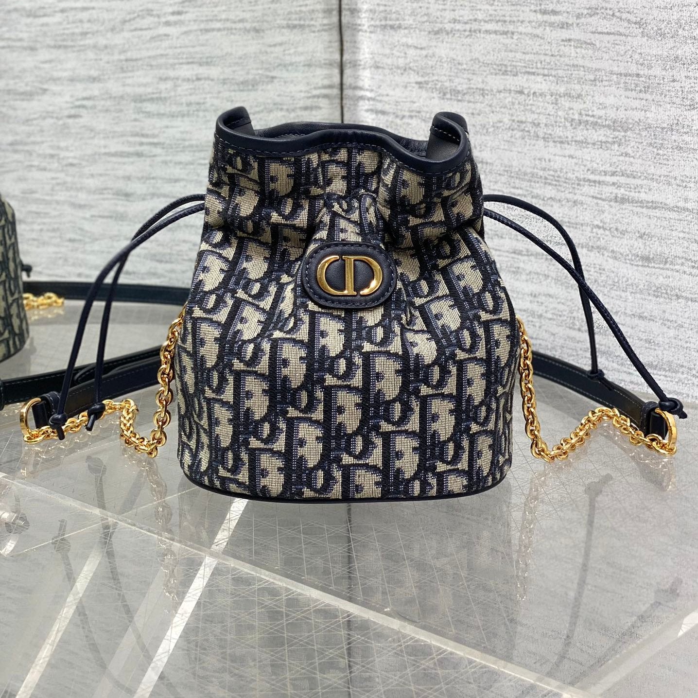 MONTAIGNE MINI 18 BUCKET BAG WITH DRAWSTRING IN BLUE OBLIQUE JACQUARD