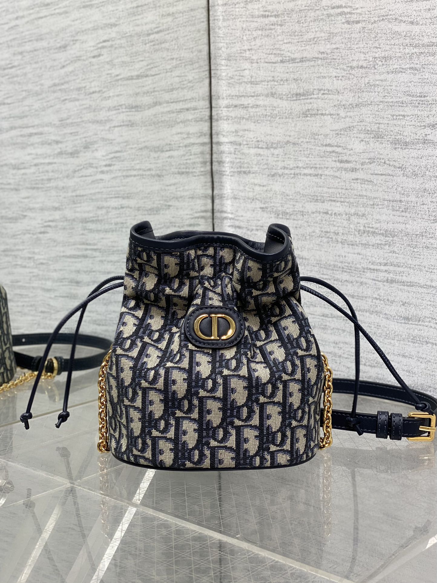 MONTAIGNE MINI 18 BUCKET BAG WITH DRAWSTRING IN BLUE OBLIQUE JACQUARD