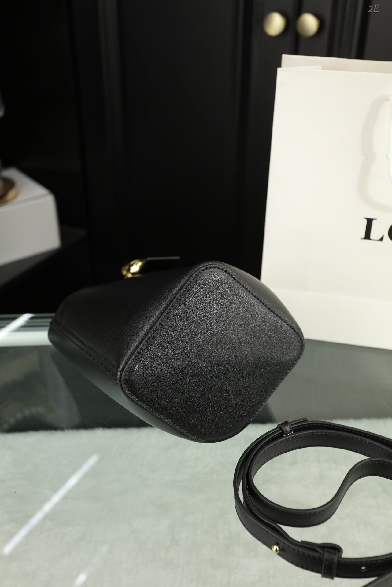 LOE MINI 19 PEBBLE BUCKET IN BLACK MELLOW CALFSKIN