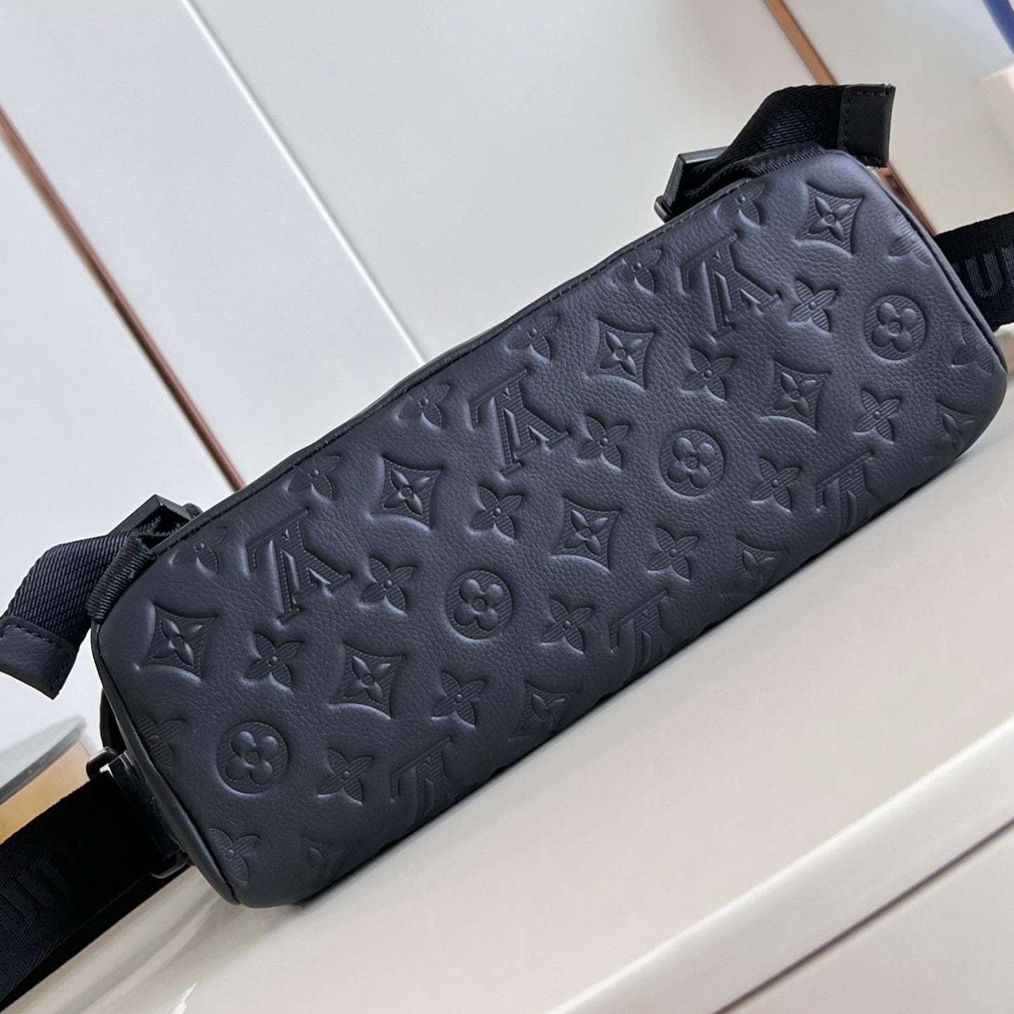 MESSENGER VOYAGER PM 33 IN BLACK MONOGRAM SHADOW CALFSKIN