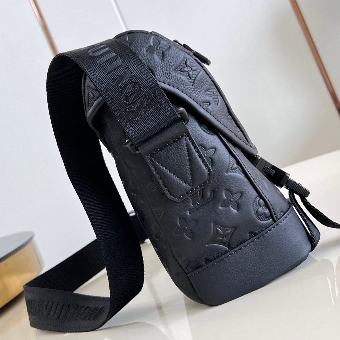 MESSENGER VOYAGER PM 33 IN BLACK MONOGRAM SHADOW CALFSKIN