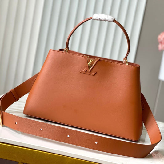 CAPUCINES SOUPLE GM 38 IN COGNAC CALFSKIN GOLD HARDWARE