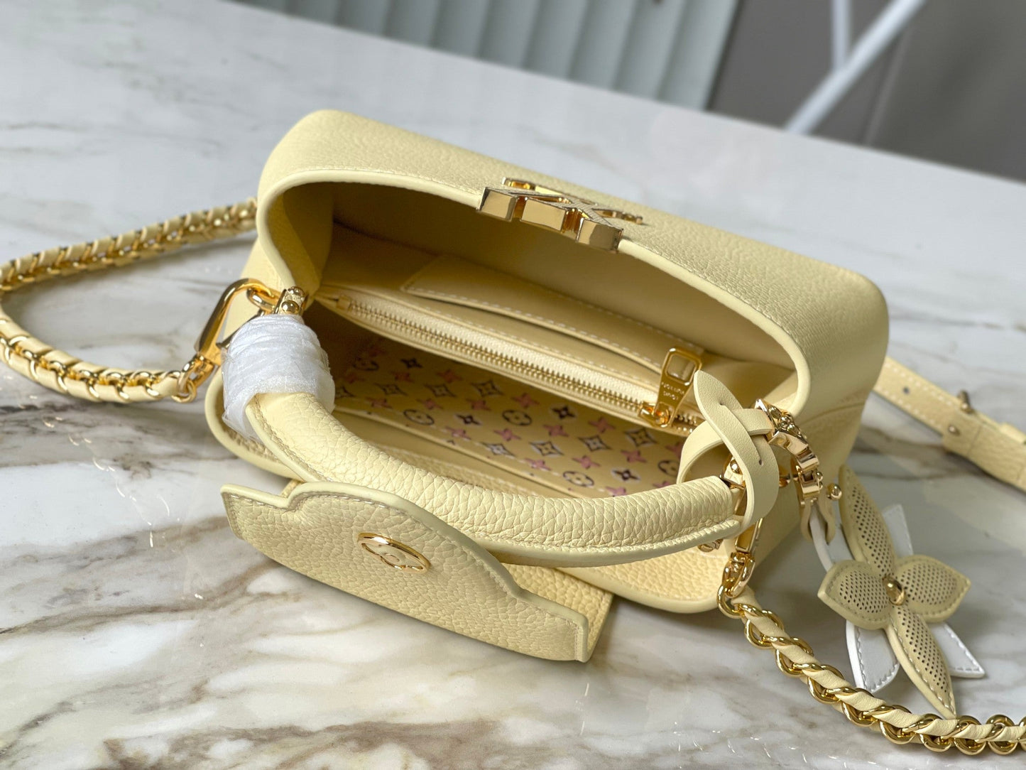 CAPUCINES EAST-WEST MINI 22 IN BANANA YELLOW TAURILLON GOLD HARDWARE